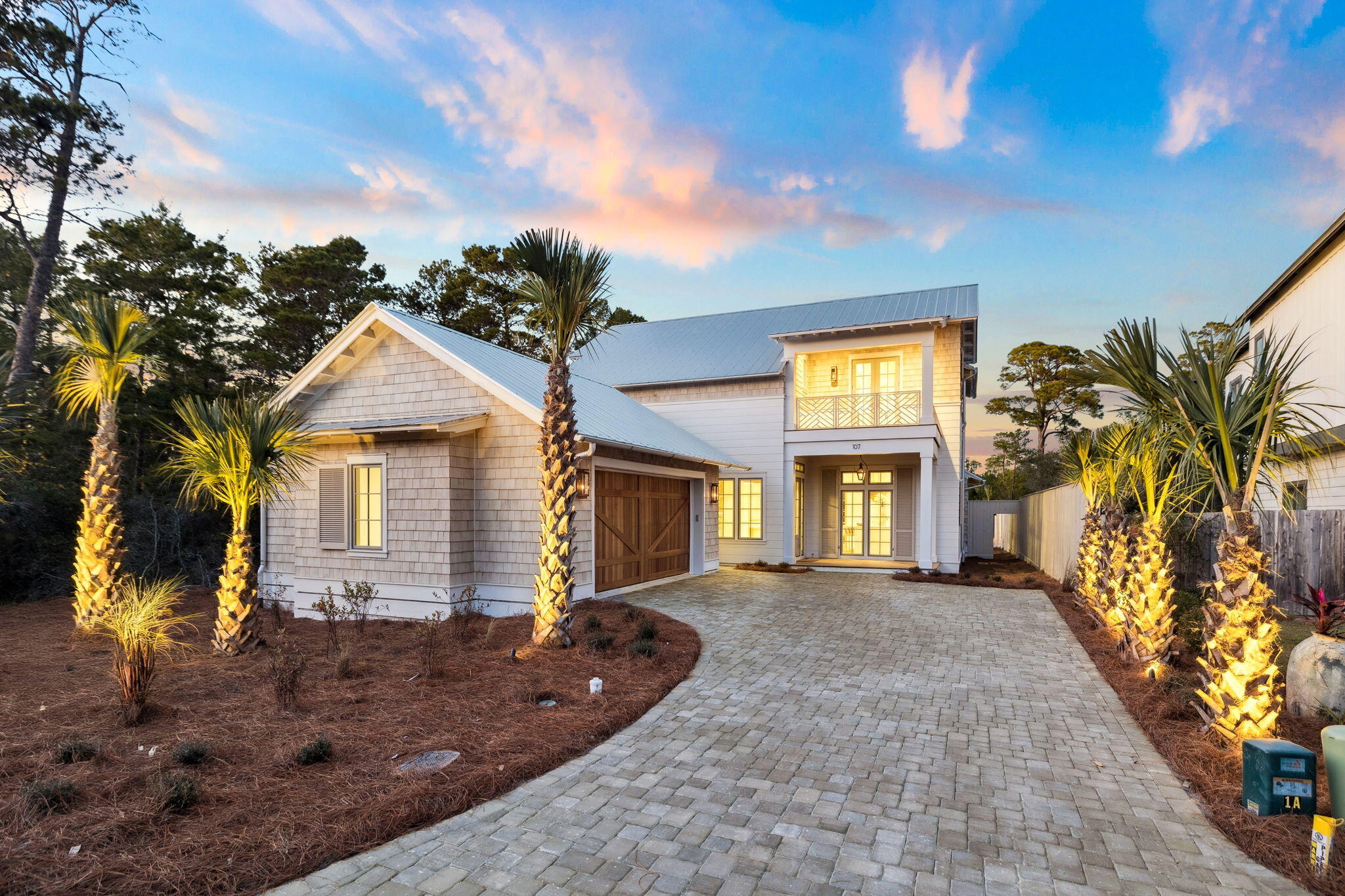 Set directly on the shores of Lake Powell, this exceptional waterfront residence delivers rare lakefront living with a private dock, boathouse, and boat lift, offering effortless access to one of Northwest Florida's most pristine coastal dune lakes. A viewing terrace atop the boathouse creates a true destination for sunrise mornings and sunset evenings overlooking serene water and surrounding nature views. Experience the best of both beach and lake living, with the Gulf of Mexico just minutes away.

Designed by Rafi Inez and built by Focus Construction, the home blends refined coastal architecture with thoughtful craftsmanship. The exterior features cedar accents and Hardie board siding, complemented by gas lantern lighting, Ipe decking, and professionally designed landscaping with palm trees, turf green space, landscape lighting, and a private putting green.

Inside, the home showcases poplar wood ceilings, hardwood floors throughout, and custom hand-fabricated railings that add architectural interest. The kitchen is outfitted with Thermador appliances, Taj Mahal quartzite countertops, and custom cabinetry by Marquis Fine Cabinetry, along with a walk in pantry featuring a built in Thermador coffee maker. The open living area is anchored by a gas ventless fireplace and expansive EuroWall sliding doors that open fully to the outdoor living space, pool deck, and serene water and nature views beyond.

Outdoor living is a focal point, featuring a heated private pool and hot tub, a gas fire feature on the pool deck, and a fully equipped outdoor kitchen with ice maker and wine refrigerator. The fenced backyard offers privacy while maintaining uninterrupted water and nature views, creating an ideal setting for entertaining or relaxing year round.

The home offers four bedrooms, four full bathrooms, and one half bath, including a spacious primary suite with a large walk in closet, gas fireplace, spa style bathroom with walk in shower and separate garden tub, and peaceful water and nature views. Additional highlights include a second floor living area, dedicated office, bunk room with full over full bunks, large laundry room, and a two car garage pre wired for an electric vehicle charger.

This Lake Powell waterfront property combines luxury finishes, modern design, and true boating lifestyle in one of Inlet Beach's most sought after settings. A rare opportunity to own a thoughtfully designed home where water, nature, and the beach lifestyle come together seamlessly.