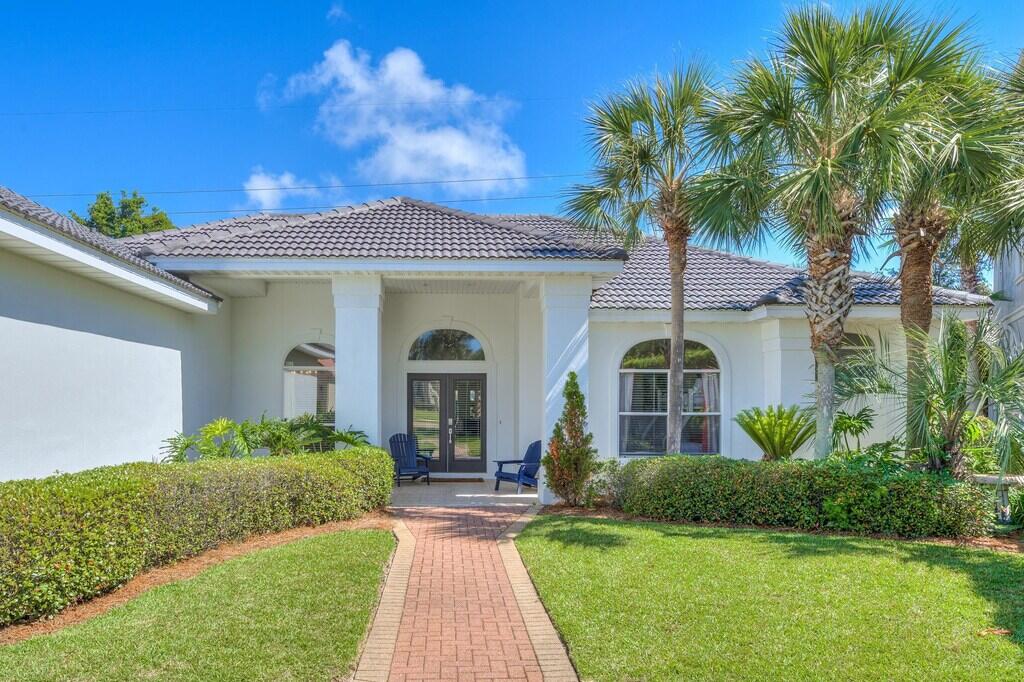 **ASK LIST AGENT ABOUT 100% FINANCING OPTION WITH NO PMI FOR OWNER OCCUPANTS** SELLER WILLING TO GIVE 25K TOWARDS POOL INSTALLATION WITH AN ACCEPTABLE OFFER! Enjoy the sugar white sands of the Emerald Coast in your next vacation home or luxury rental. This established airbnb has been renovated from top to bottom and generates close to $100,000 in annual gross income! **Being sold fully furnished** Located in the elite community of Destiny East and just minutes to the beach, this 4 bedroom home features lvp flooring throughout and light and airy paint colors. 10-12 foot ceilings are throughout making the home incredibly spacious. Prepare a meal in the gourmet eat in kitchen equipped with modern appliances, quartz countertops and a big breakfast bar.  Watch your favorite show in the family room just off of the kitchen so you don't miss any of the action. 

Two bedrooms are located on the west side of the home, the principle on the east and the bunk room in the middle. The master bedroom has a king bed with silver chill mattress to keep you cool on those hot summer days. Double doors from the master open up onto the back porch. If you do encounter a summer shower, how about a movie on the overstuffed sectional and wide screen TV or a BBQ on the covered patio. The primary bathroom features a 70 inch soaker tub, oversized vanity w/ dual sinks, walk in marble tiled shower and spacious closet.

The bunkroom features a full sized mattress & three twin memory foam beds. A second full bathroom is just across the hallway and has a tiled walk in shower with access to the backyard. The other two bedrooms each have queen sized mattresses and beachy decor. The shared full bathroom is beautifully remodeled with tub/shower combo and tiled surround, vanity with dual sinks and quartz counters. You have full access to two luxurious pools, a hot tub, tennis courts, a full size workout facility and playground.  Discover all that Destin has to offer, including boat rentals, water sports, deep sea fishing charters, sunset cruises, and top rated attractions like the Big Kahunas Waterpark. Try out the Crab Trapp, Pompano Joes,  and the Whale's Tail. There are tons of dining options right on the beach. Grab a cup  coffee in the morning. There is no shortage of things to do nearby.