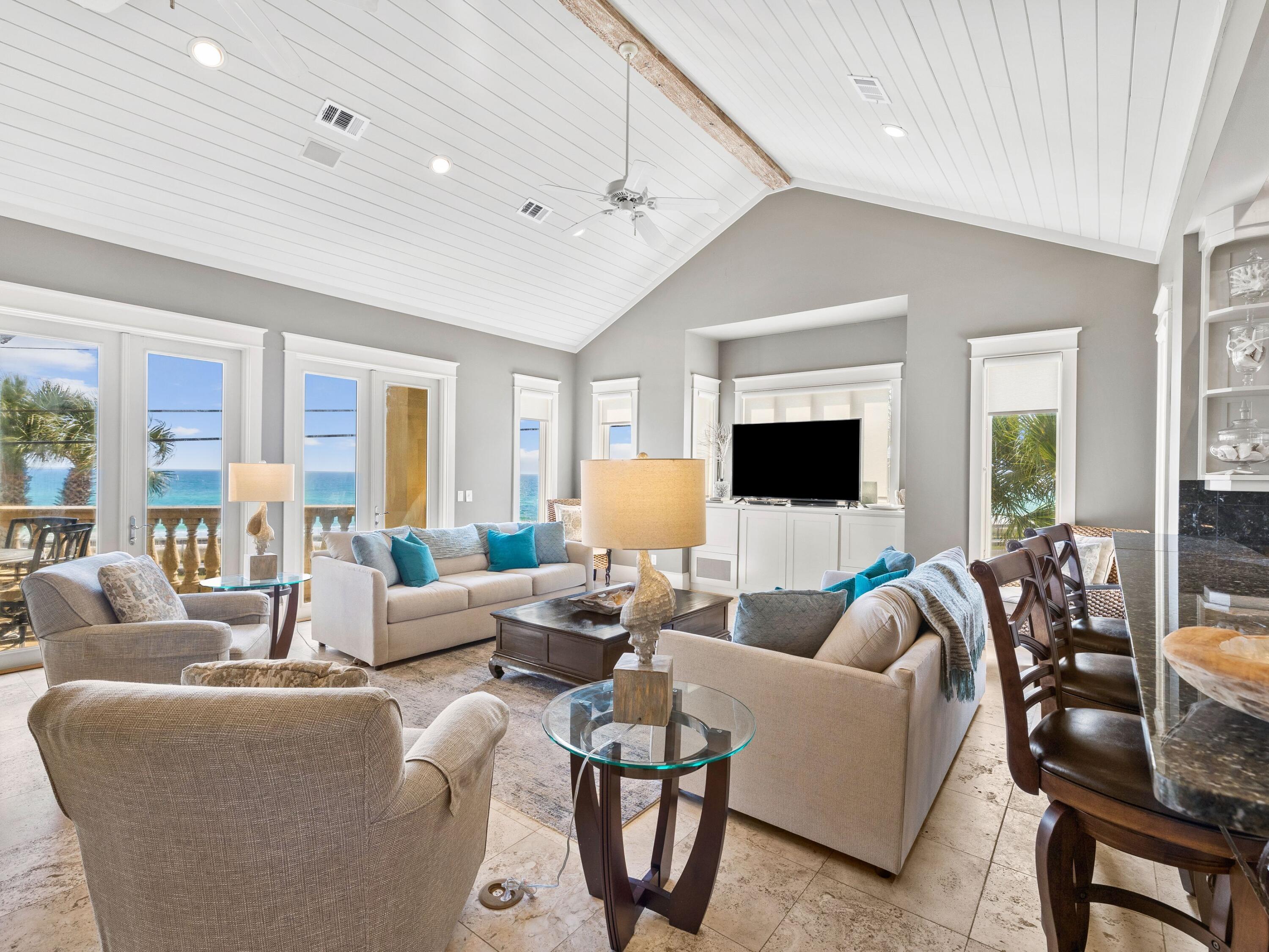 Imagine having a vacation home with sweeping views across Scenic Hwy 98 towards the beautiful white sandy beaches and Gulf of Mexico. This elegant Mediterranean-style home is set on private landscaped grounds that include an alluring swimming pool and sun deck. Step through the door of this impressive two-story home and appreciate the quality finish throughout. The first floor has a spacious family room with a sitting area, mini kitchen, wet bar and desk area. Two guest bedrooms each have their own ensuite bathroom and access to the patio and pool area. There's also a large bunk room for five that could be used as a media room, home gym or game room. Outside you'll find a private walled garden with swimming pool and sun terrace to enjoy on sunny days. The main open-concept living space and kitchen are on the second floor, taking full advantage of the stunning beach views, especially at sunset. The fresh bright living space has vaulted plank ceilings, new paint and some new furnishings making it move-in ready for owners or renters. A separate formal dining room is a natural space for entertaining family and friends. A row of bar stools is lined up along the high-top breakfast bar. Full-height cabinets, stainless appliances and granite counters make this gourmet kitchen both practical and beautiful. Also on the upper floor, the incredible master suite has enormous windows framing breathtaking gulf views along with private washer & dryer. There's a plush master bathroom with twin vanities, a huge walk-in closet with a window and direct access to a covered porch for relaxing. Easy beach access via a private walkover makes this a desirable beach house. It comes with the added benefits of tennis courts, a clubhouse and a pool within the exclusive Avalon Beach Estates neighborhood.