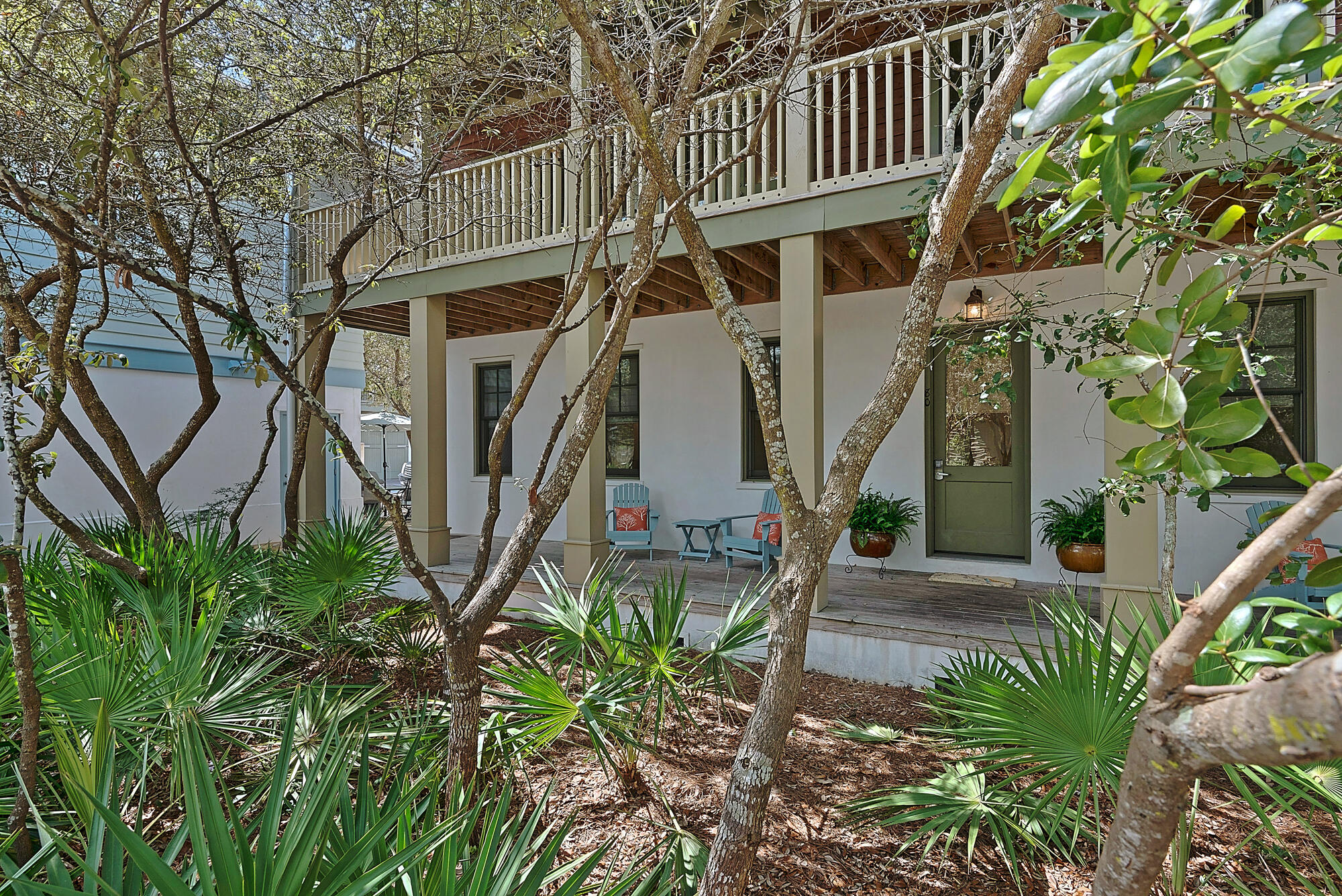 Discover the charm of Rosemary Beach in this enchanting cottage and carriage house. Perfectly situated on a desirable corner lot, this home provides easy access to the Eastern Green, the stunning turquoise blue water of the Gulf of Mexico, the refreshing Coquina Pool, tennis courts, and the vibrant town center brimming with shops and restaurants. Vacation renters rave about the fabulous location and the inviting atmosphere. Over $212K rental revenue 2023.

The main cottage exudes a cozy, treehouse feel with its large wraparound upstairs porch, nestled amidst the trees. Inside, all three beautifully appointed bedrooms, each with its own ensuite bath, are located on the first floor, ensuring privacy and comfort. Ascend to the second floor to find a bright, airy living space where the