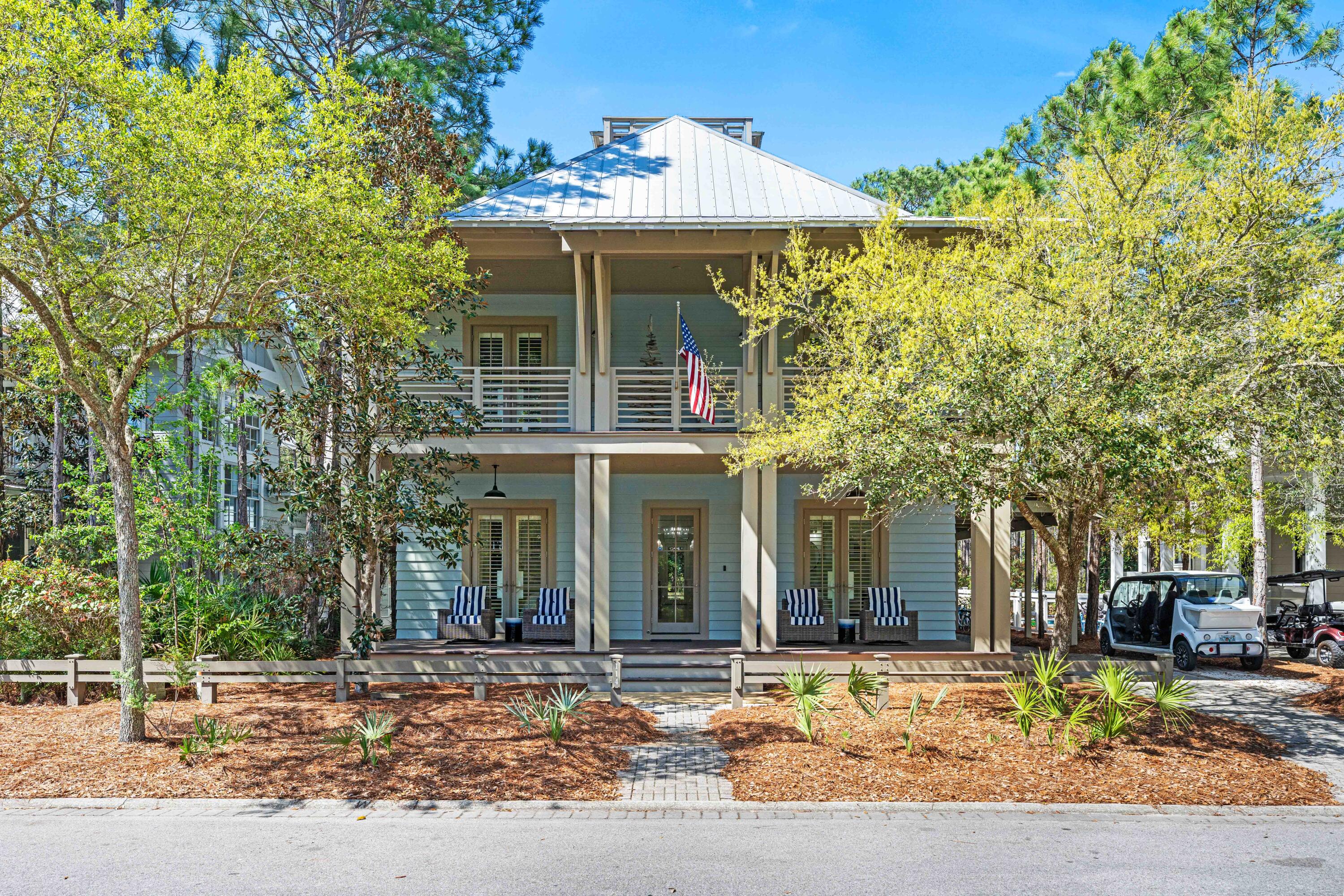 Nestled in the Forest District of WaterColor's Phase II, 114 Pine Needle is a stunning 6-bedroom, 6.5-bathroom cottage blending classic Florida charm with modern comfort. Bright white walls, cheerful furnishings, and coastal blue accents create a warm, inviting atmosphere. Five bedrooms feature en suite baths, with ample space for any group. The 2nd floor entertains with a huge open living area, kitchen, and dining that spills onto a 34' wide deck overlooking the private preserve. The 3rd & 4th floors offer a kids/sitting room and tower with mini kitchen—perfect for sunset views. Three sitting areas and five spacious porches ensure relaxation and connection for large families. Conveniently near Camp WaterColor and a short bike ride to the Gulf Front Beach Club with 3 pools along the Gulf Golf Cart included