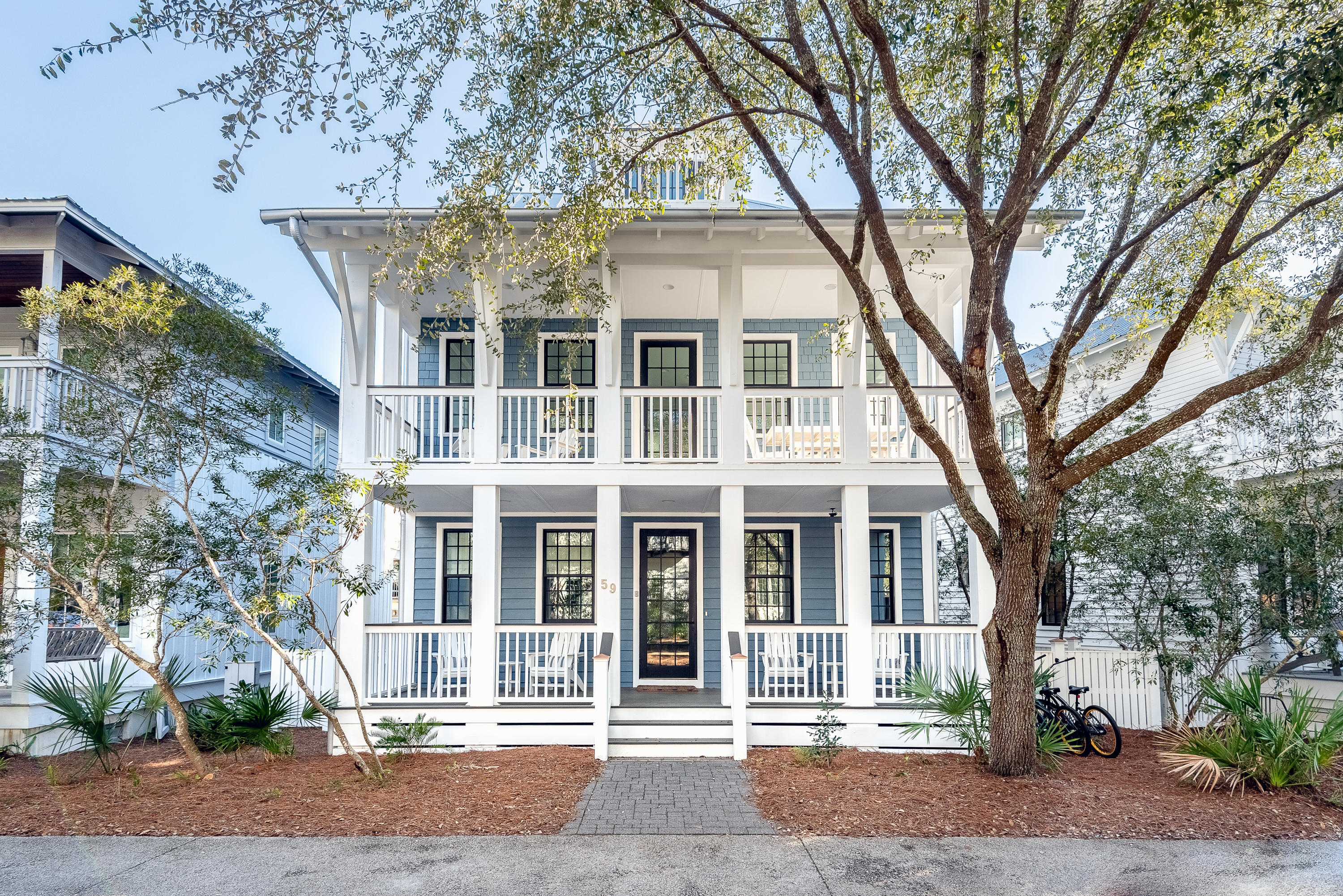 This impeccably maintained 4BR/4.5BA home with private carriage house pairs timeless coastal design with a prime walkable location; just steps from the Town Center and directly across from the Cabana Pool.

Sold fully furnished and never used as a rental, the home lives like new. Thoughtfully curated across three levels, it blends crisp finishes with a relaxed beach-house feel. The reverse floor plan maximizes natural light, with the main living space upstairs offering two spacious sitting areas, a dedicated dining room, and a beautifully appointed kitchen with marble countertops, premium appliances, and a generous center island perfect for gathering. Two guest suites on the main level, including a king primary with en-suite bath and oversized closet, offer comfort and privacy. Covered porches on both levels extend the living space outdoors; ideal for morning coffee, evening breezes, or dining with views of the pool and park.

Upstairs, a generous bunk suite features four built-in bunks, a full bath, and its own balcony. A breezeway leads to the detached carriage house above the two-car garage, complete with its own kitchen, living room, bedroom, and full bath; perfect for extended guests, in-laws, or flexible use.

Recent updates include a new HVAC system and a fully encapsulated & conditioned crawl space, adding comfort and long-term efficiency to your investment. With access to Rosemary Beach's full suite of amenities, this home offers an elevated coastal lifestyle in one of 30A's most beloved neighborhoods; whether you're seeking a forever getaway, a pristine second home, or strong rental potential.