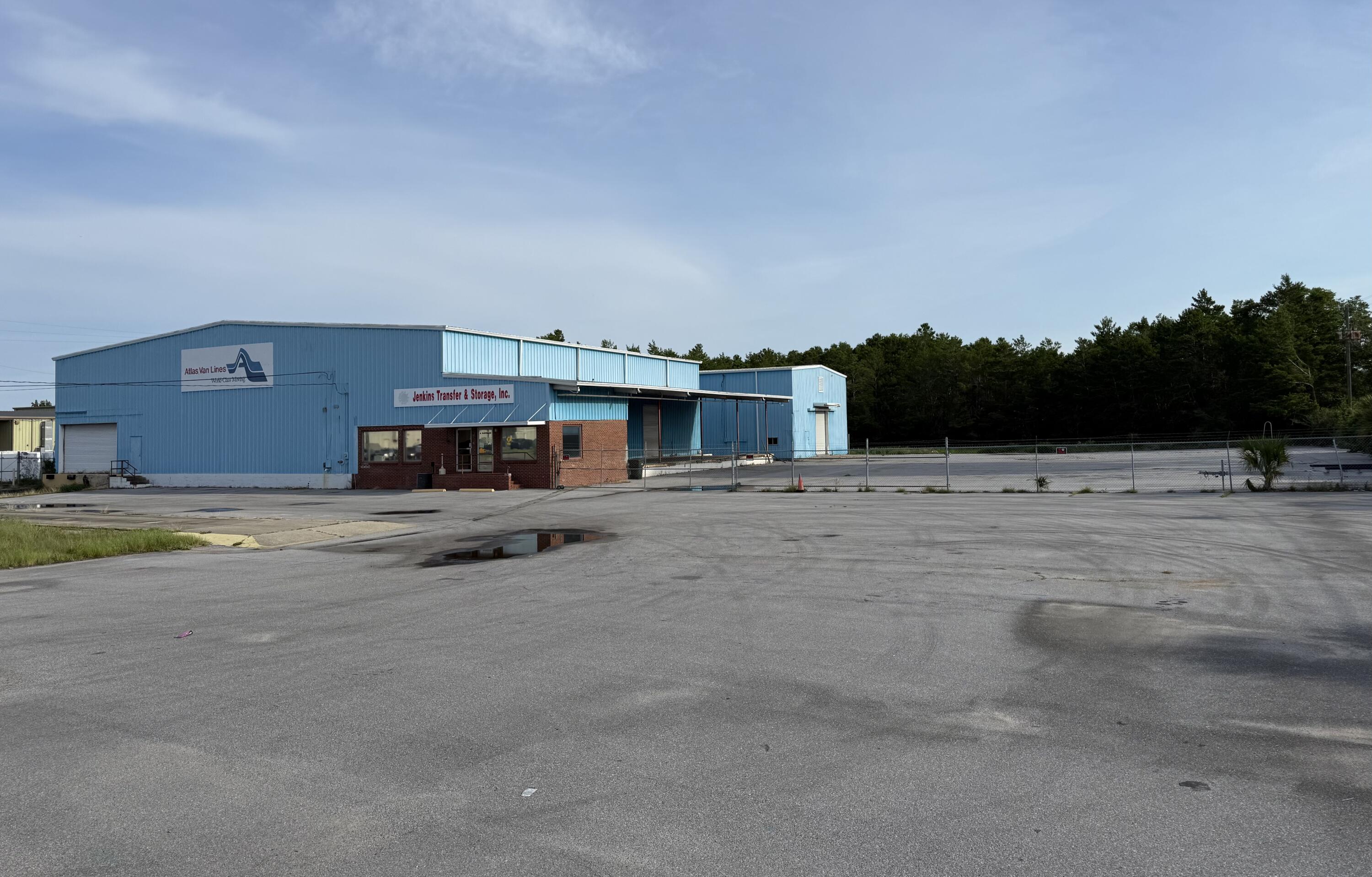 The property includes approximately 16,000 square feet split between two warehouse buildings—one around 10,000 square feet with adjoining office space and another 6,000 square feet structure. With 25-foot ceilings, a freight dock, side dock, drive-in access, and an on-site truck scale, the site is designed for efficient operations. The 2.48 acre lot is  fenced, providing secure outdoor storage or staging, and the building shell is ready for tenant improvements or owner customization. Low annual expenses and its prime location just off Highway 98 make it an attractive option for logistics, warehousing, light manufacturing, or investment. This is a flexible property with strong infrastructure and potential for both users and investors.