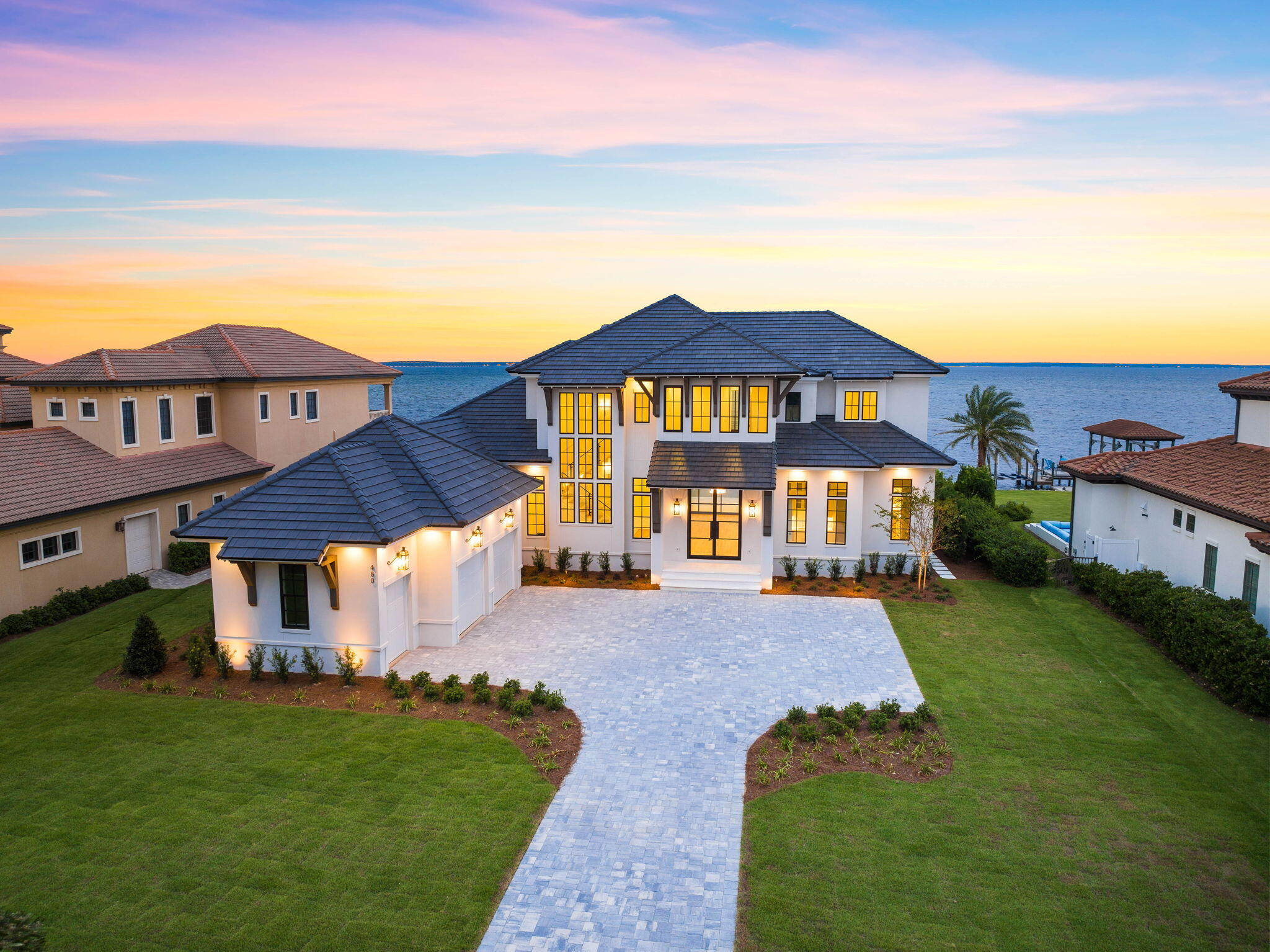 Welcome to 480 Captains Circle, an exceptional residence nestled within the prestigious Regatta Bay community—an idyllic haven where luxury living seamlessly harmonizes with the surrounding natural beauty.

Boasting six bedrooms, six and a half bathrooms, a well-appointed wet bar, a heated and cooled saltwater pool, a chic summer kitchen, 2-car garages with additional golf cart garages, and a 30-foot boat dock complete with a boathouse, this home offers the epitome of luxurious living. Step into the backyard and experience the serene allure of Bayfront living, perfect for unwinding while soaking in stunning sunsets or indulging in water-based activities. This home, constructed by Vlahos, DeBogory & Tuck Construction, comes equipped with modern technology and high-quality finishes. You'll find Wolf and Subzero appliances in the kitchen, along with stylish hardwood and marble flooring throughout. Plus, the house is wired for smart home features, making it easy to control and connect your devices.

480 Captains Circle epitomizes the quintessential Emerald Coast lifestyle. World-class golf, upscale shopping, boating excursions, dining, and pristine beaches are all easily accessible via a convenient golf cart ride.

Please reach out to us today for the cost-to-own and rental projection figures for the property.