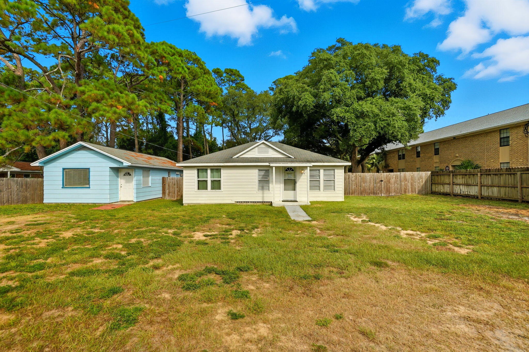 Investor's dream! Two properties on one lot in the heart of Fort Walton Beach offering dual income streams. 115 Chicago Ave is a 3BR/2BA home with 1,378 sq ft, built in 1951, and currently operates as an Airbnb that can be sold fully furnished and turn-key. 113 Chicago Ave is a 1BR/1BA home with 672 sq ft, built in 1978, and serves as a long-term rental generating $800/month on a flexible month-to-month lease. Live in one, rent the other, or maximize returns with both!  2020 & 2022 HVACs and 2021 water heaters. Located just minutes from shopping, dining, downtown Fort Walton Beach, and the sugar-white beaches of the Emerald Coast, this property provides instant cash flow and long-term potential.Property Website (https://www.115chicagoavese.com/unbranded)