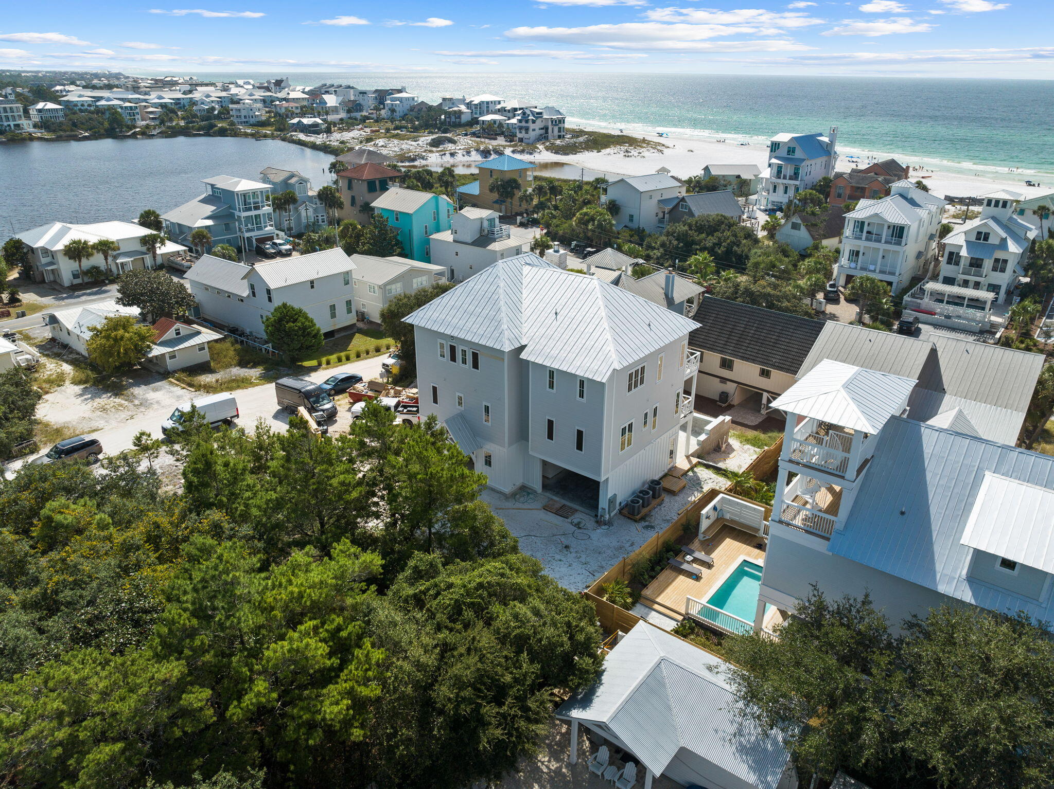 'Something to Sea,' as this Santa Rosa Beach property is affectionately named, is quite literally just that...something to see! Located just steps to the beach, 24 Dalton Street is a custom-built, exclusive retreat offering the best of beach living: privacy, enviable Gulf of Mexico views, and Eastern Lake water views, all being built on not one, but two large lots, in a quaint part of 30A. The property's prime location and architectural details on three levels of indoor and outdoor living exude a sense of place, where one instantly knows they are both in the heart of South's most sought-after beach town, yet quietly tucked away near the seashore. This home's design is prominently steeped in coastal heritage with exquisite finishes that feature time-honored craftsmanship and coastal opulence, defining investment properties on Florida's Emerald Coast. Enjoy breakfast overlooking the beach as the sun rises to the east and toast the sunset when the day is done...all from Something to Sea's private wrap-around terrace. 

The 4558 square foot, 5 bedrooms, 5 1/2 bath home's design details were thoughtfully curated by Tennessee interior designer C. Santos, and the home is being constructed under the direction of Martin Builders. Each of the three terrace levels were intentionally positioned to boast views of the Gulf of Mexico and Eastern Lake, providing the soothing sounds of the surf, serene views of walking trails, and mesmerizing sunsets. The home's high-tech, high-touch design features enviable amenities to enhance the owner's experience; the property also features a swimming pool with waterfall accents, a large entertaining game room with wet bar, a cozy outdoor fireplace overlooking the pool area, an outdoor kitchen with commercial grade grilling station, oak hardwood floors throughout, private automobile garage, a luxury commercial grade elevator, a wine room with Pecky Cypress Accent ceilings and a custom wine cellar door, to name a few. The property has room to park six automobiles. 

This beautifully appointed home is being sold fully furnished, and will be ready to move in late November 2023 to start making your memories...Something To Sea.
An extraordinary opportunity awaits to own your 30A compound. And with a short distance to Seaside, Bud and Alleys, WaterColor, The Big Chill, restaurants, bike paths, and all 30A has to offer, this home truly has it all.

Property Features of note, by level: 
LOT FEATURES/LOCATION:
Double Lot
Spacious outdoor parking for over 6 Full Size vehicles
Eight hundred feet from the Eastern Lake Beach access, this home embodies the charm of old Florida, complimented by state-of-the-art amenities. Views of the Gulf and Eastern Lake captured from all Terrace Areas.
Offered Fully Furnished.
SQUARE FOOTAGES
First Floor: 1136 SF
Second Floor:1673 SF
Third Floor: 1749 SF
Total (H& C) 4558 SF
FIRST FLOOR:
1 ½ Car Garage
The front door entrance features a foyer with Pecky Cypress Ceiling Accents.
Wine Room with Pecky Cypress Accent Ceilings and Custom Cellar Door
Large Entertaining Game Room with Wet Bar.
Opening to Outdoor Living Space
Commercial Grade Outdoor Grilling Area
Outdoor Fireplace
Pool with Water Fall Features
Full Bathroom on the first level
Commercial Grade Elevator
Oak Hardwood Floors
SECOND FLOOR:
Second Floor Features Gathering Area 
4 Bedrooms with each its bathroom
Second Floor Features Outdoor Wrapping Around Terrace Overlooking the outdoor 1st-floor living and pool area.
Elevator Access
Oak Hardwood Floors
THIRD FLOOR:
Large Living and gathering area
Brick Fireplace with Cypress Mantle
Wet Bar
The kitchen features Commercial Grade Thermador Appliances
Marble throughout the Kitchen
Large Walk-in Pantry
Half Bath with Accented Gold accented Pecky Cypress Wood
Elevator Access
Master Bedroom Living area with its own terrace.
Walk-Closet
Marble Double Vanity Sinks
Marble Flooring 
Soaking Tub
Walk-In Steam Shower
Third Floor Features Outdoor Wrapping Around Terrace with sweeping views of the Gulf of Mexico and Eastern Lake
French Doors allow access to the terrace from any location on the 3rd level living area.
Oak Hardwood Floors
Exposed Cypress Beams