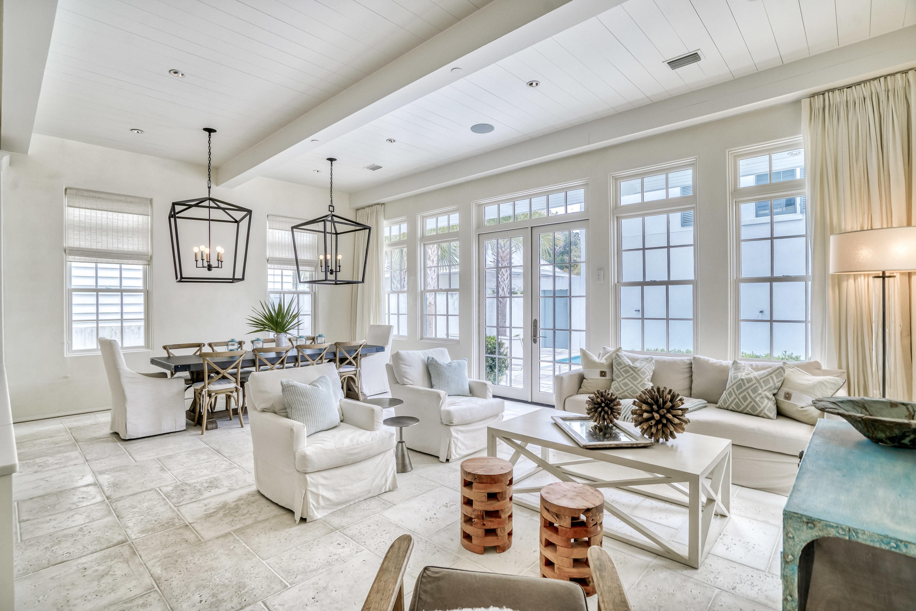 Welcome to ''The Cottages at Rosemary Beach'' by Benecki Homes of Atlanta, GA and designed by Lew Oliver, Inc.
Comfort truly meets chic in this luxury Benecki home, only 5 walking minutes away from this neighborhood's private beach and steps away from the Rosemary Beach Fitness Center and Racquet Club. 

Complete with three floors of ultimate luxury, thoughtfully designed spaces and soothing neutral tones throughout, you have space to comfortably sleep 16 people. Make your way through the foyer into the open modern kitchen, living and dining room area. Double doors into a courtyard with a private pool and water feature invite the 
exterior in. Peacock pavers in rice white throughout main floor and courtyard.
Enjoy ample space for meal preparation and entertaining There's a guest suite including a large walk-in closet on the main floor as well as a separate powder room.

The second-floor master is home to a spa-style private bathroom, which features double vanities, a walk-in shower of thassos marble, spray jets and rain shower and a huge walk-in closet. Another bedroom and the bunk bed area (with 2 extra-long twin beds) share a bathroom and the lovely ship lapped TV hang out lounge. 

The separate laundry room holds a large washer and dryer and has ample storage for linens and towels. On the top floor you're welcomed into a large room with 3 fabulous "swing" beds (custom size, larger than twin) and 1 twin trundle complete with a 
bathroom, lots of storage and a hangout area with TV. 
The kitchen is equipped with Thermador appliances, a separate wine fridge and refrigerator drawers. The cooktop has 6 burners, a griddle and double ovens.

Bianco grigio countertops and thassos marble backsplash finishes throughout the kitchen. There is ample storage space for all your cooking and entertaining needs. The 11' ceilings and venetian plaster walls on the main floor give this bright and open 
house an extra airy and luxurious feeling. 

The detached two car garage is loaded with space to store bikes, chairs and even two generously sized vehicles. Above the garage is the carriage with a cozy living room opening into the beautiful and 
fully equipped kitchen area with fossil stone countertops, a separate bedroom with a queen-sized bed, a bathroom and laundry area all separated by sliding doors. There is a second story loft where 2 more guests can sleep just a short climb on the 
beautiful wooden ship ladder above. 

Thassos marble floors in all bathrooms except main floor. Limestone, Bianco grigio or fossil stone countertops. Hardwood floors 2nd and 3rd floor and carriage house.

The sellers spared no expense in making this a truly spectacular home. Never rented and gently used. Professionally decorated by Diane John Design of Atlanta.