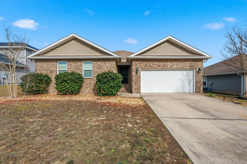 Move In ready, great location south of I10, conveniently located to Eglin/7th Group/EOD school. This home features an open-concept living area with a split-bedroom floor plan. The heart of the home is the expansive kitchen, complete with a large island/breakfast bar, perfect for entertaining or busy weekday mornings. Retreat to the private Owner's Suite, where you'll find a spa-like ensuite featuring a garden tub, separate shower, dual vanities, and a massive walk-in closet. Step outside to your covered back porch, an ideal spot for morning coffee or evening BBQs overlooking your level backyard. Situated in a quiet neighborhood this home offers the perfect balance of peace and convenience. New Roof 2024, newer appliances stove/dishwasher/built in microwave.