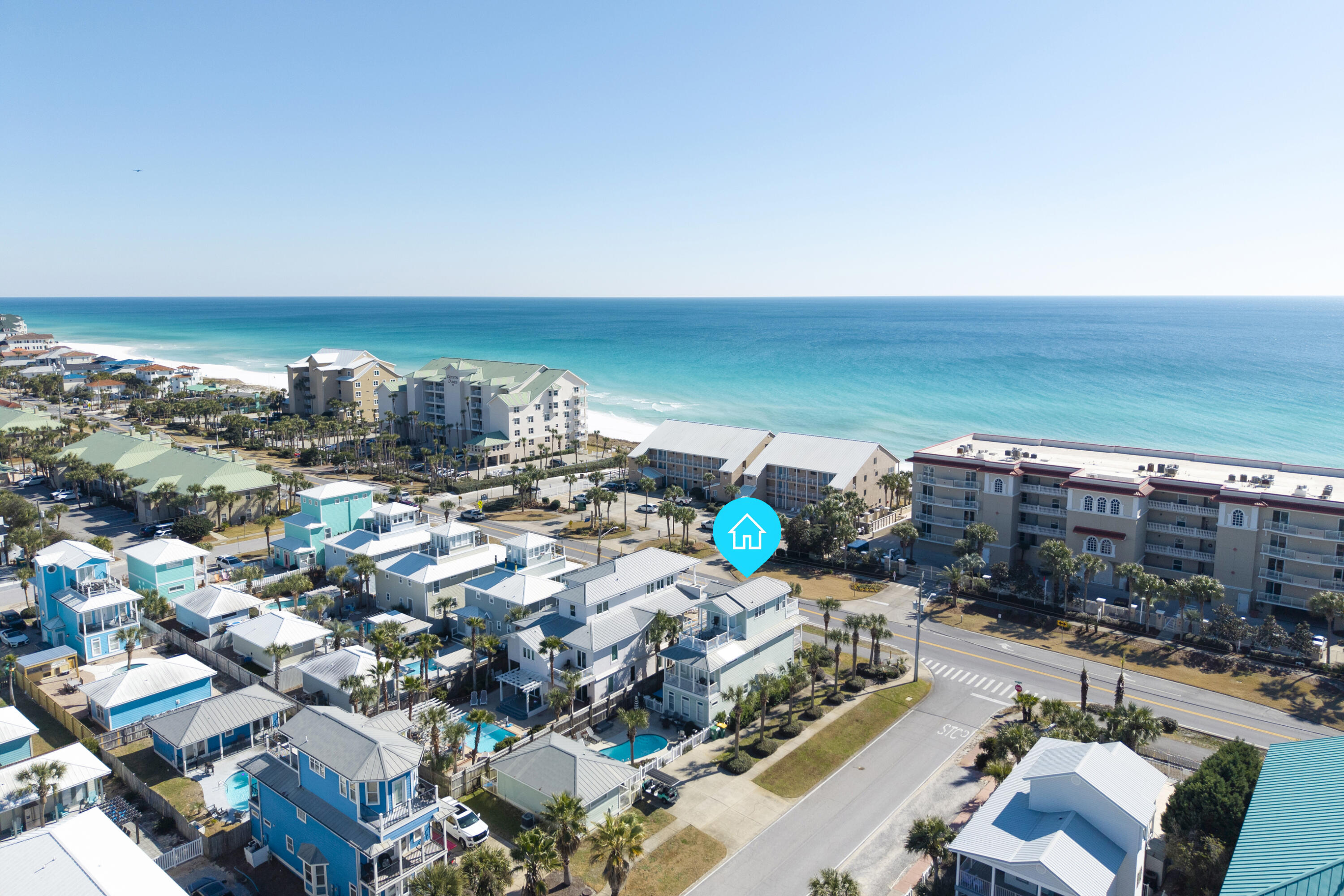 YEAR TO DATE BOOKINGS AS OF JULY  1, 2026, $217,086.52
Located directly along Scenic Hwy 98 on a prominent corner lot, this exceptional three-story coastal retreat offers Gulf views from the second & third levels and is just 0.1 miles from the Shirah Beach Access, a leisurely 2-minute stroll to the sugar-white sands. Thoughtfully designed & impeccably maintained, the property presents a rare ''two-homes-in-one'' configuration ideal for personal enjoyment & high-performing short-term rental use. The 4-bedroom main residence is complemented by a separate 2-bedroom carriage house, with a heated pool & pool deck serving as the private focal point between the two structures. This flexible layout provides privacy & versatility well-suited for hosting guests, multi-generational living, or maximizing rental potential. The carriage house also features a kitchenette, a full bathroom, and a walk-in closet, offering comfortable & independent accommodations. The home is tastefully decorated & offered turnkey, featuring solid surface flooring throughout, multiple living areas, and balconies positioned to capture Gulf breezes & views. A golf cart is included, enhancing convenience for beach access & easy enjoyment of the surrounding coastal community.

From an investment perspective, the property demonstrates outstanding performance, generating $225.1K in rental income in 2024, $235.4K in 2025, and already securing $129.2K in confirmed bookings for 2026. With its prime Scenic 98 location, Gulf views, flexible accommodations, and proven income history, this offering represents a compelling opportunity in one of Destin's most sought-after beach communities.