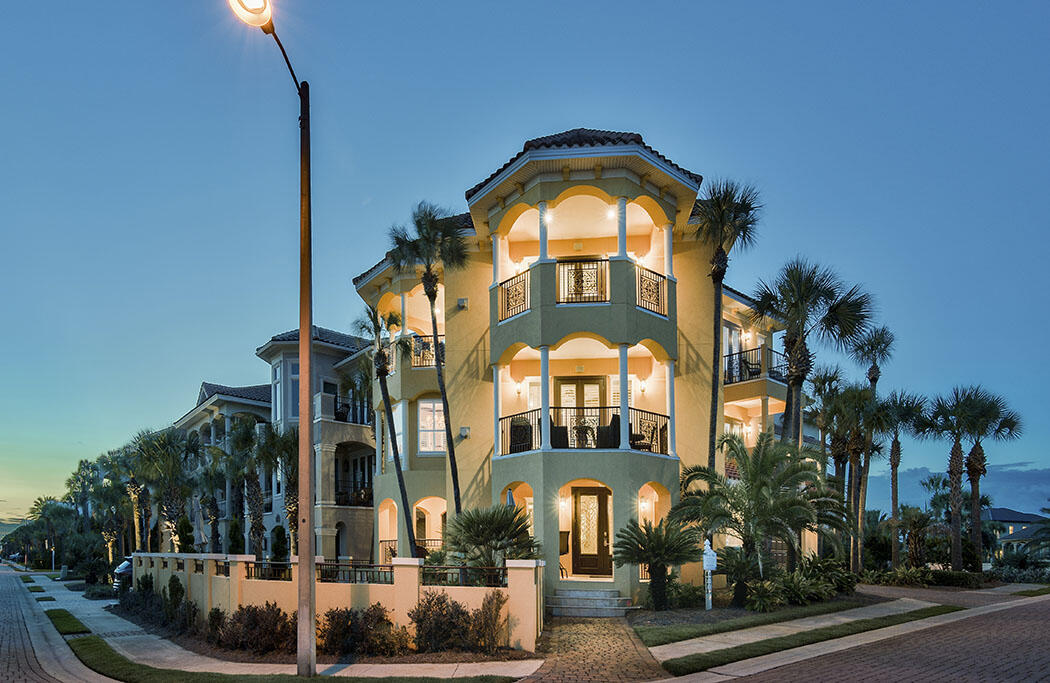 Stunning First Tier Mediterranean style home offers breath taking views of the Gulf of Mexico from 7 balconies in nearly every room.  ''Tuscan Villa'' is located on a corner lot with the Gulf visible to the east, west, and south.  Relax on the tanning bed in the secluded tile pool with spa tucked behind a privacy wall in front of the home. An elevator expedites guests between floors in this impeccable 5 bedroom 5,5 bath home with updated Contemporary decor.  Private deeded beach access is located a few doors down and across the street. 2nd Floor Kitchen features granite counters, wine cooler, center island, stone backsplash and a breakfast bar open to the living area with cozy fireplace and dining area. Elegant 3rd Floor Master suite has fireplace, wet bar, en suite bath and 2 balconies.