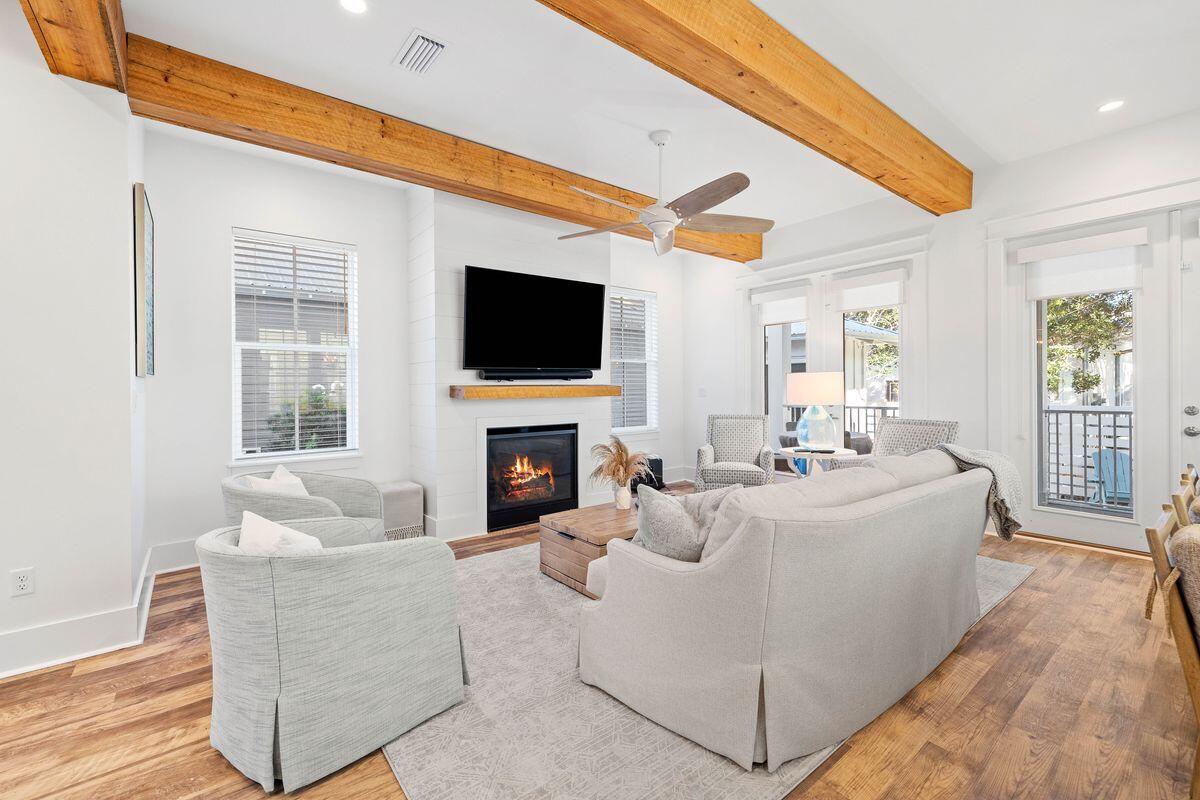 Space and light are all-important at this fully furnished, almost brand new home in Seacrest Beach. Five beds, two sitting rooms, a swanky outdoor kitchen and a rare private pool make this a most desirable residence for those looking for a luxurious coastal lifestyle. Private balconies on all three levels provide quiet space for relaxing or starting the day gently with a cup of coffee. Designed to accommodate larger families and guests, the open floor plan effortlessly blends style with practicality. No area demonstrates this better than the gourmet kitchen, equipped with quartz counters and top-of-the-line Viking appliances for rustling up home-cooked favorites or celebratory menus. The long white breakfast bar will be the social hub for pre-dinner drinks while delicious aromas emanate from the six-burner gas stove. A neat butler's station accommodates a wine refrigerator beneath the staircase. Rustic wood-effect flooring and sturdy beams anchor the home while the gas fireplace creates a warming glow. The floor plan flows effortlessly from the dining area to the sitting room where high-end furnishings by Lovelace Interiors reflect the laid-back coastal vibe. All five bedrooms have ensuite bathrooms, some tucked discreetly away behind a sliding barn door feature. Kids will love the cozy bunk room that features four beds, all with their own TVs. A wet bar with a refrigerator enhances the third-floor bonus room, allowing guests to grab coffee or soda while watching TV. The outdoor space is a private oasis designed for cooling off in the pool, sipping cocktails or relaxing on the terrace. The shady porch offers year-round alfresco living with a built-in barbecue in the summer kitchen and a wall-mounted TV so you never miss a match. Move-in ready, this turnkey property is a shrewd investment for those looking for favorable returns from the get-go. The high demand for vacation rentals in this area provides strong income potential for larger homes with pools, such as this. Days are filled with fun activities taking in the 12,000-sq.-ft. lagoon pool, beach boardwalks, shopping, dining and live entertainment. Hop aboard the convenient tram service and head to the sugar-white sands and balmy Gulf of Mexico waters or enjoy the array of local businesses lining 30A.