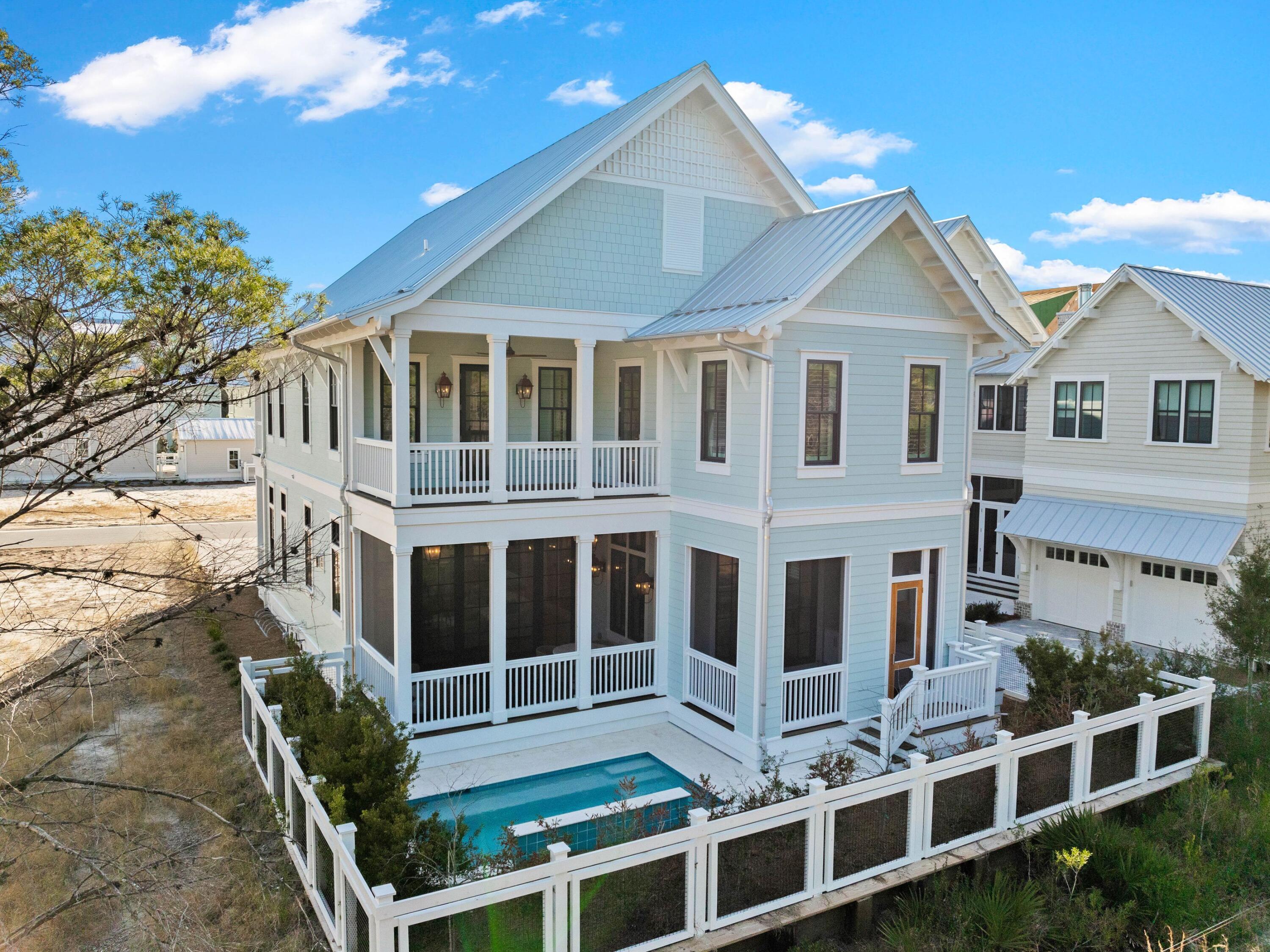 Newly Built • Fully Furnished • Priced to Sell

Tucked away in WaterColor's final and most private phase, this new turnkey luxury home backs to the untouched beauty of the State Forest—offering rare privacy, peace, and proximity to all the amenities that define the 30A lifestyle.

This brand new home is thoughtfully designed for comfort, elegance, and ease. Sold fully furnished and enhanced with new plantation shutters throughout, it features:

4 bedrooms | 4.5 baths

2 living areas (one up, one down) for flexibility and family fun

2-car garage with EV charging + bonus storage

Private elevator and dual laundry rooms

Custom wet bar with wine fridge, perfect for entertaining The heart of this new home is the beautiful kitchen, complete with white Shaker cabinetry, white oak island, Wolf range, Sub-Zero fridge, Cove dishwasher, and an oversized island made for gathering!

A wall of bi-fold glass doors opens fully to a screened porch  blending indoor luxury with outdoor serenity. Relax by the splash pool with spillover feature, host happy hour from the outdoor summer kitchen, and unwind with forest views as your backdrop.

Upstairs, the primary suite is a true sanctuary with custom built-ins, and there's a second beverage bar in upstairs living area for added convenience.

Additional features include:

Beamed ceilings, designer lighting, and warm wood floors

400 sq ft of attic storage

Gas fireplace

Located in the non-rental phase of WaterColorperfect for primary or second-home owners

Enjoy access to the exclusive WaterColor Beach Club, Camp WaterColor, trails, parks, and more. With a motivated seller who is willing to consider a trade, this new home is dialed in and priced to selldon't miss the opportunity to own one of WaterColor's finest new homes.