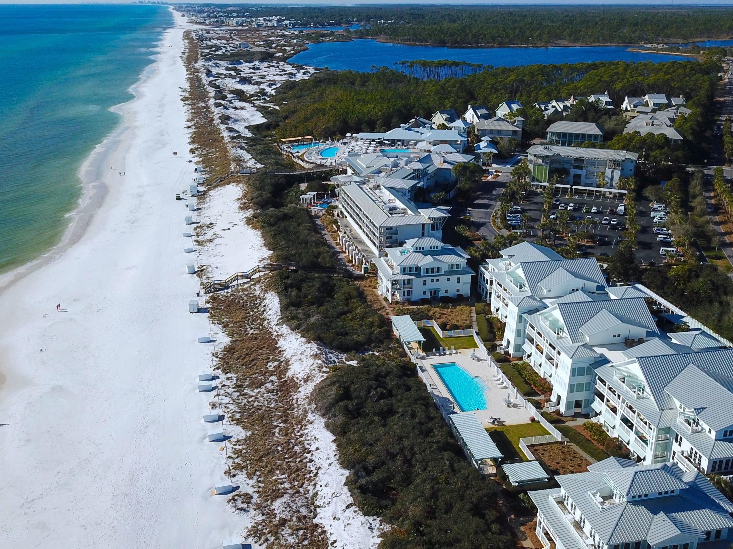 Presenting this rare opportunity to own a spacious three-bedroom gulf-front condo in the community of WaterColor. Located on Scenic Highway 30A, this two-story unit features beautiful wood flooring in the main living areas, high ceilings, and a chef's kitchen with stainless steel appliances and granite countertops. Enjoy gulf views from the upper balcony, easily accessed by both the gulf-front living room and master bedroom on the second level. Porch access from the first floor leads directly to an expansive pool reserved for owners and their guests. Additional amenities include dedicated parking and a storage area - both of which can be found in the first-floor garage. Just a short walk from iconic 30A shopping and restaurant destinations, this conveniently-located beach condo offers abundant ways to enjoy the luxury lifestyle along Scenic Highway 30A.