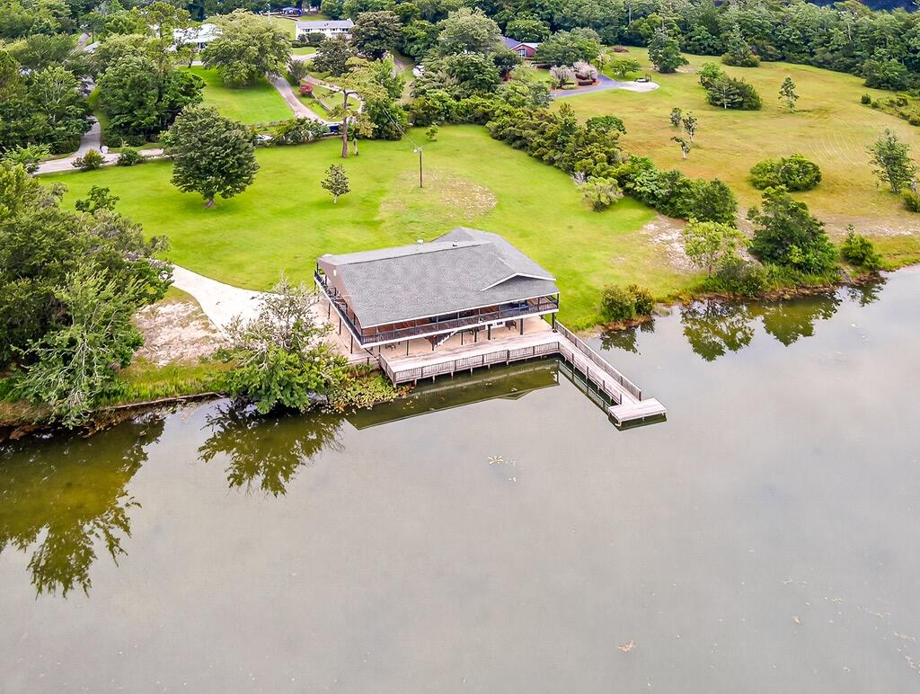 *SHORT SALE! Offering $500 EMD, Buyer Closing Cost Assistance, and Home Can Be Assumed!* A Waterfront Gem with Unlimited Potential! Welcome to serene lakefront living on gorgeous Lake Bagdad. This two-story home sits on approximately 1.2 private acres with over 200 feet of water frontage — a rare find that combines natural beauty, spacious living, and incredible potential. Inside, you'll find 3 bedrooms and 3 full bathrooms spread across a flexible floor plan with two fully equipped living spaces  perfect for family, guests, or exploring rental possibilities. With over 2,400 square feet, the home features a large great room with sweeping lake views and a kitchen with ample counter and cabinet space ready for your personal touch. The spacious 3-car carport is ideal for vehicles, a boat, or weekend toys.

Recent updates give you a head start on modernizing: newer roof, updated windows, 3 out of 4 new exterior doors, refreshed A/C units and handlers, a newer water heater, and refreshed upstairs living areas  all while leaving plenty of room to make the home your own.

Step outside to enjoy the ultimate lake lifestyle. Relax on the expansive waterfront deck, launch your kayak, or fish off your private dock. With over an acre of mature lakefront land, there's room for gardens, pets, or simply soaking in the sun.

Originally built in 1975, this home offers timeless charm, solid bones, and endless potential. Whether you're an investor, a visionary renovator, or a family dreaming of a private lakefront retreat, this is the opportunity you've been waiting for.

Located in a quiet, private setting with no HOA restrictions, yet just a short drive to all Milton has to offer, this home is priced to allow you flexibility while building equity.

This isn't just a property, it's a lifestyle, a project, and a dream all in one. Come see what's possible on Riley Road and get ready to fall in love with lakeside living!