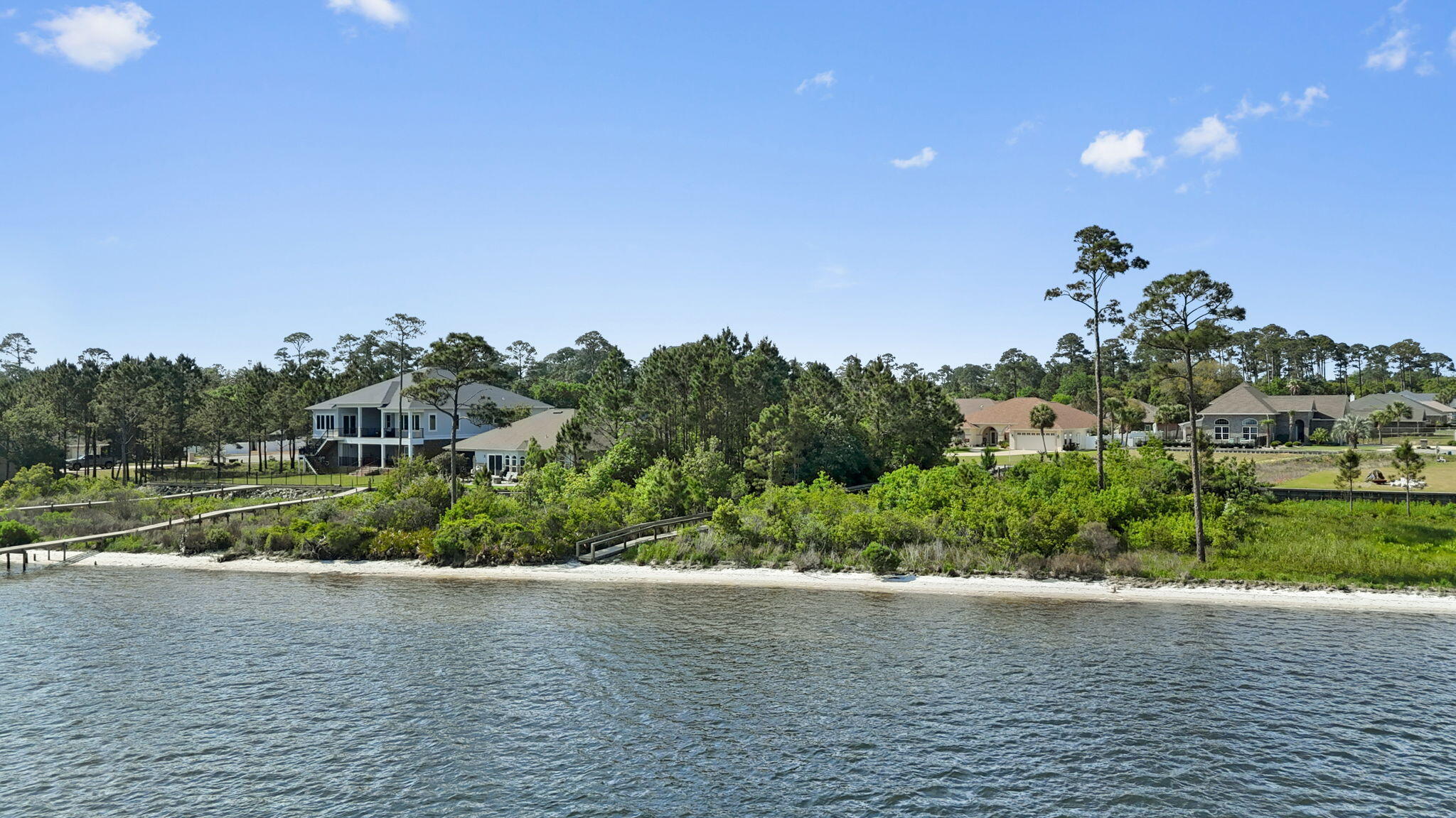 Welcome to Villa Vizcaya, a highly sought-after waterfront community perfectly positioned just off Highway 98. With its impressive sweeping entrance, charming sidewalks, and underground utilities, Villa Vizcaya offers both elegance and convenience. This beautiful lot presents a rare opportunity to build your dream home overlooking the tranquil Intracoastal Waterway, with captivating backdrop views of Santa Rosa Island and the sugar-white sands of Navarre Beach. Ideally located just a few miles west of the Navarre Beach bridge, this desirable neighborhood is close to local shops, top-rated schools, and offers quick access to Hwy 87, I-10, and regional airports in Pensacola and Destin. Whether you're envisioning a permanent residence or a coastal retreat, this lot offers the perfect blend of serene waterfront living and accessibility to the best of Florida's Gulf Coast. Don't miss your chance to own a slice of paradisecall today for more information.