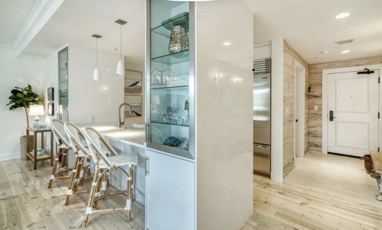 This classy renovation in the heart of Rosemary Beach Town Center, enjoys the close proximity to the vibrant entertainment venues of Restaurants & Shops as well as the privacy and quiet of a well insulated structure. The balcony overlooks Barrett Square Park with views of the West Indies inspired architecture of the Town Center buildings and Town Hall. Enter the Foyer with  whitewashed pecky cypress walls and French sconces, then progress to the expansive Living/Dining adjacent to the Italian Kitchen with a Wolf/Subzero appliance package. Each of the 3 Bedrooms are in separate corners of the condo allowing further seclusion. The renovation also included marble baths, built-ins, new plumbing, electric and refinished floors throughout.