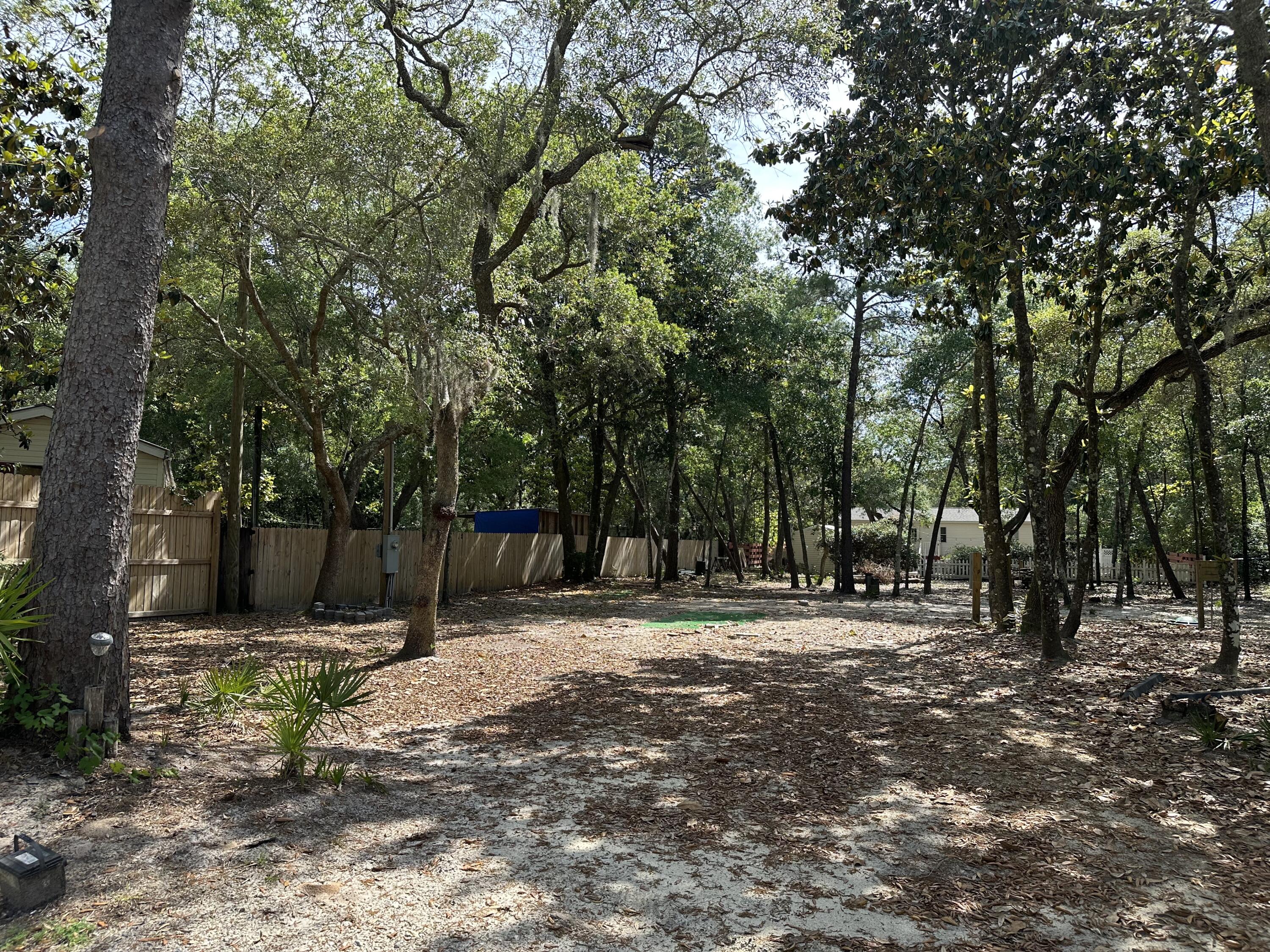 Location* High and Dry, NO HOA investment or development opportunity. This .52 acre lot is a mile away from Sacred Heart Hospital and minutes away from all that Destin and 30A beaches have to offer. Currently outfitted with slab, power and plumbing for RV storage.