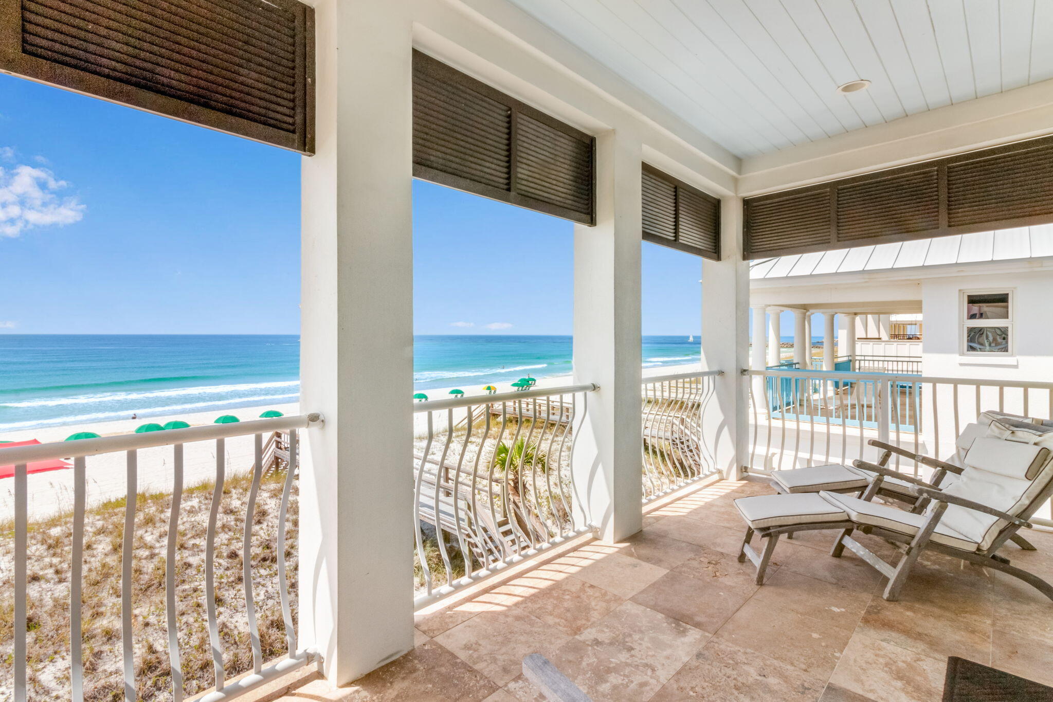 Welcome to Seas The Day, a 4 bedroom, 4.5 bath beach front home in the gated coastal lifestyle community of Destin Pointe, nestled on Destin's enchanting Holiday Isle. This remarkable property offers a lifestyle of luxury and serenity across its three thoughtfully designed floors. With 36 feet of awe-inspiring beach frontage, you'll be captivated by panoramic vistas of the Gulf of Mexico's turquoise waters and the picturesque East Pass, creating an ambiance of coastal bliss.
Upon entering the first floor, you're met with a lock out suite of a bedroom, 1.5 baths, living area, laundry room and fully equipped kitchen. Travertine floors throughout with custom inlay in the foyer, granite countertops and stainless appliances in the kitchen. More... Just off the living area is a private patio with direct access to the semi-private dune walkover.
Moving to the upper floors, engineered hardwood flooring and shiplap wall treatments add warmth and charm, complementing the coastal aesthetic. Expansive south-facing windows and French doors frame breathtaking views, ensuring that the captivating surroundings remain an integral part of your daily life. The 12-foot ceilings accentuate the openness of the layout, allowing natural light to flood the interiors and amplify the sense of grandeur. Crown molding throughout the home adds a touch of sophistication, exemplifying attention to detail in every corner.
The open-concept layout on the second floor creates an inviting atmosphere, with the living room, dining area, and kitchen flowing seamlessly together. Large windows bathe the interior in natural light and offer stunning views of the surrounding landscape.  The kitchen is a masterpiece of design and functionality featuring granite countertops, top-of-the-line appliances, ample counter space, and a breakfast bar standing as both a culinary haven and a gathering place for cherished moments. 
Just down the hall is a second bedroom and dedicated bath with bunk beds, built-in armoire and access to a north facing, covered balcony.
The third floor greets you with a beach front master suite that is a true sanctuary, featuring a spa-like bathroom with a soaking tub and a spacious walk-in closet with two built-in armoires, a walk-in closet that will satisfy even the most discerning buyer. The wetbar's double refrigerator, sink and coffee nook provide the perfect place for all your comfort food and snacks. It's private balcony offers a prime place to soak in those relaxing coastal sounds and gorgeous Florida sunrises and sunsets.  Down the hall, you pass another convenient laundry station en route to the last bedroom with en suite bath, another built-in armoire and north facing balcony that is perfect for star gazing on warm summer evenings.