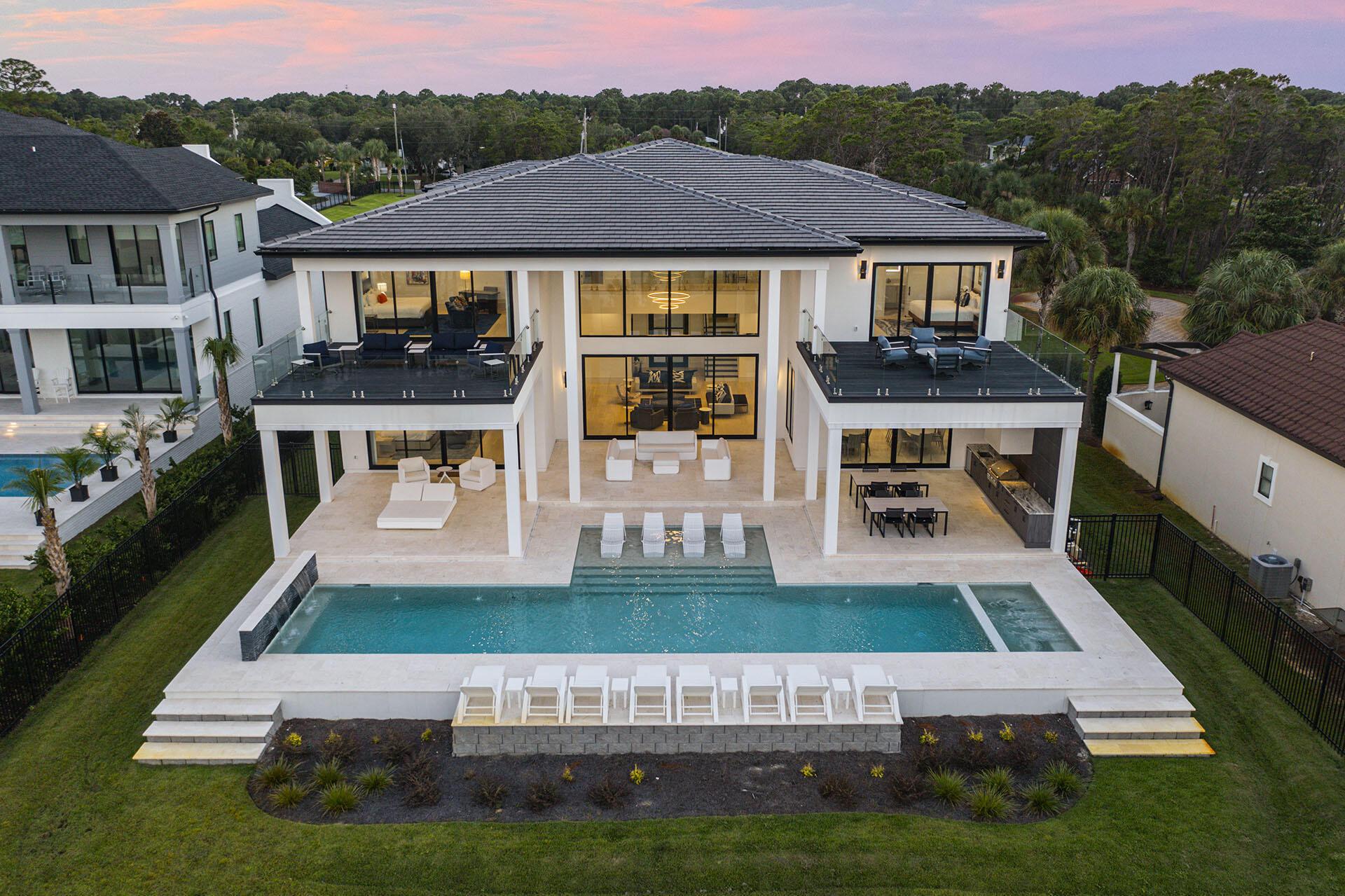Nestled in the heart of Miramar Beach, 396 Walton Way is a breathtaking new-build estate that epitomizes the art of refined coastal living. Spanning 12,000 square feet, with 7,632 square feet of heated and cooled space, this home boasts a timeless design, state-of-the-art amenities, and unrivaled proximity to the Gulf of Mexico. Every detail has been thoughtfully considered, from the curated selection of high-end finishes to the seamless flow between indoor and outdoor living areas. Featuring $600,000 worth of luxurious designer furniture from premier European and American brands, this spectacular residence offers an unparalleled lifestyle of comfort, elegance, and sophistication. As you approach the property, you're greeted by lush landscaping and a meticulously designed exterior that blends with the natural beauty of the surrounding area. The spacious open-concept floor plan showcases expansive living spaces, highlighted by soaring ceilings, custom millwork, and an abundance of natural light. Every element has been meticulously crafted, from the handpicked selection of exquisite finishes to the harmonious connection between indoor and outdoor living spaces. Featuring $600,000 worth of luxurious designer furniture from the most prestigious European and American brands.

The gourmet kitchen is a chef's dream, featuring top-of-the-line appliances, sleek cabinetry, and a large center islandideal for both casual dining and entertaining. A standout feature of this kitchen is the private door leading to the impressive walk-in pantry. This hidden gem is outfitted with a secondary fridge, a deep sink for prep work, and ample storage, ensuring the ultimate in convenience for both everyday living and entertaining on a grand scale.
The adjoining living and dining areas are perfect for hosting guests, while the expansive sliding glass doors lead to a stunning outdoor oasis.

Outside, the luxurious pool and spa provide the ultimate in relaxation, with serene views of the beautifully landscaped grounds. Whether you're lounging on the sun deck, enjoying al fresco dining on the patio, or unwinding in the hot tub, the outdoor spaces are designed to complement the relaxed, yet refined coastal lifestyle.

The master suite is a sanctuary, complete with a private balcony, spa-inspired bathroom, and a spacious walk-in closet. Additional bedrooms and guest suites offer privacy and comfort, ensuring that friends and family feel right at home. With smart home technology, a state-of-the-art home theater, and ample storage space, no detail has been overlooked.

Located just moments from the pristine beaches of Miramar Beach and world-class dining, shopping, and entertainment, 396 Walton Way offers the perfect blend of exclusivity and convenience. This is not just a homeit's a statement. A rare opportunity to own a piece of paradise in one of the most sought-after locations on the Emerald Coast!