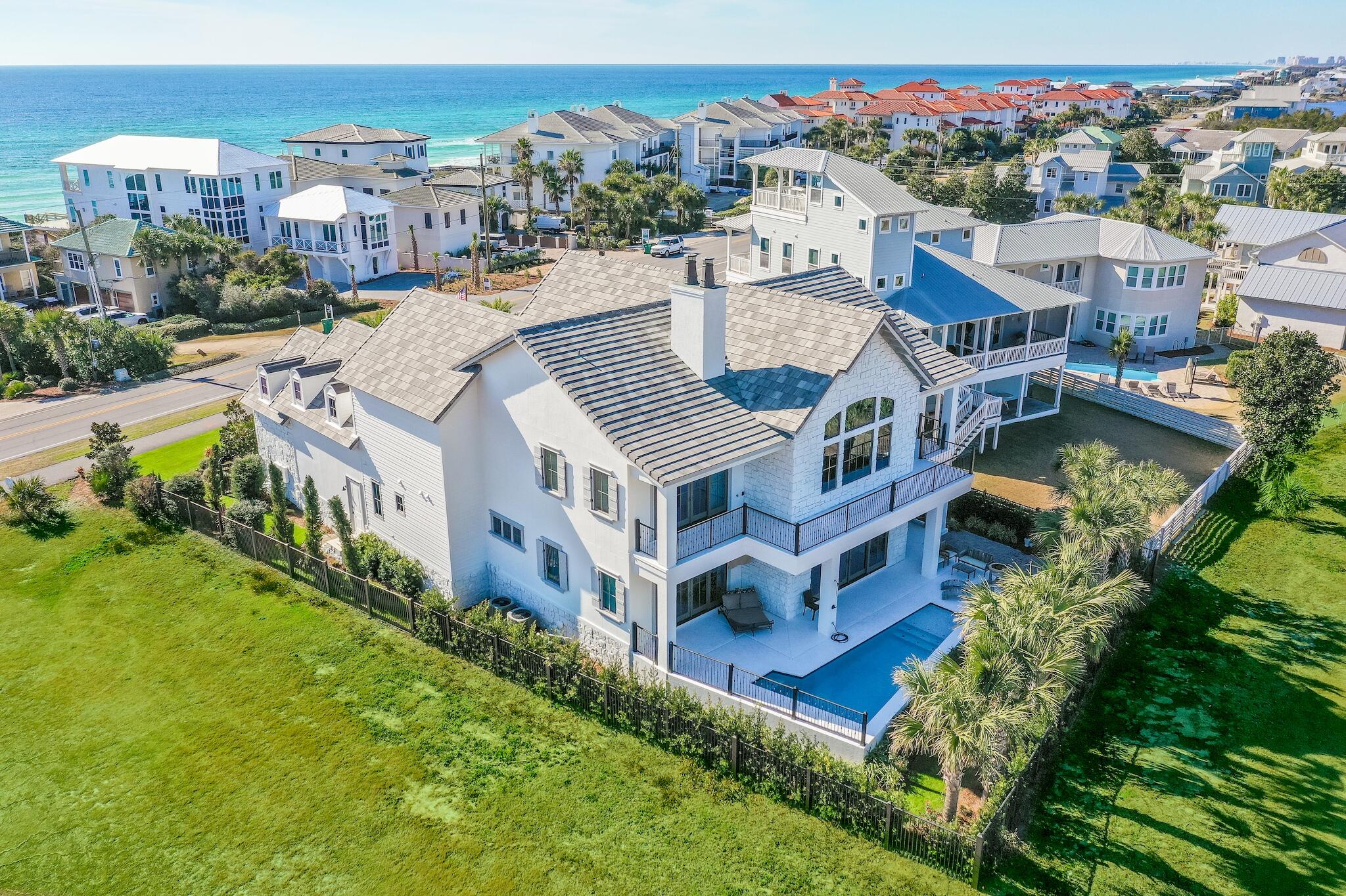 This one of a kind custom home is located in the premier spot along 30A taking full advantage of the views of both the Santa Rosa Beach & Golf club and the Gulf of Mexico all while overlooking your own private pool. Built by local award winning builders Dixon Kazek here on the Emerald Coast with luxury, quality and pride of ownership in every detail. Just a few of the details include quartz counter tops, custom cabinetry throughout - sliding custom barn doors, a curved majestic staircase, wood beams, a state of the art home theater with a private bar in addition to the custom bar off the main living area make this home perfect for entertaining or rental.  Beach access is just steps away - no HOA to contend with. walking distance to Gulf Place A large oversized garage plus a gated private entry as well as two fireplaces, custom landscaping and lighting, this home has it all.  The room over the garage is finished off and would make a perfect bunk room for additional sleeping, making this the perfect rental property or primary residence.  Exterior of the home has recently been repainted.  Home has a diesel generator, spray foam insulation and two oversized tankless water heaters and a cement roof.  Flood insurance is not required, Buyer to verify all dimensions and details.