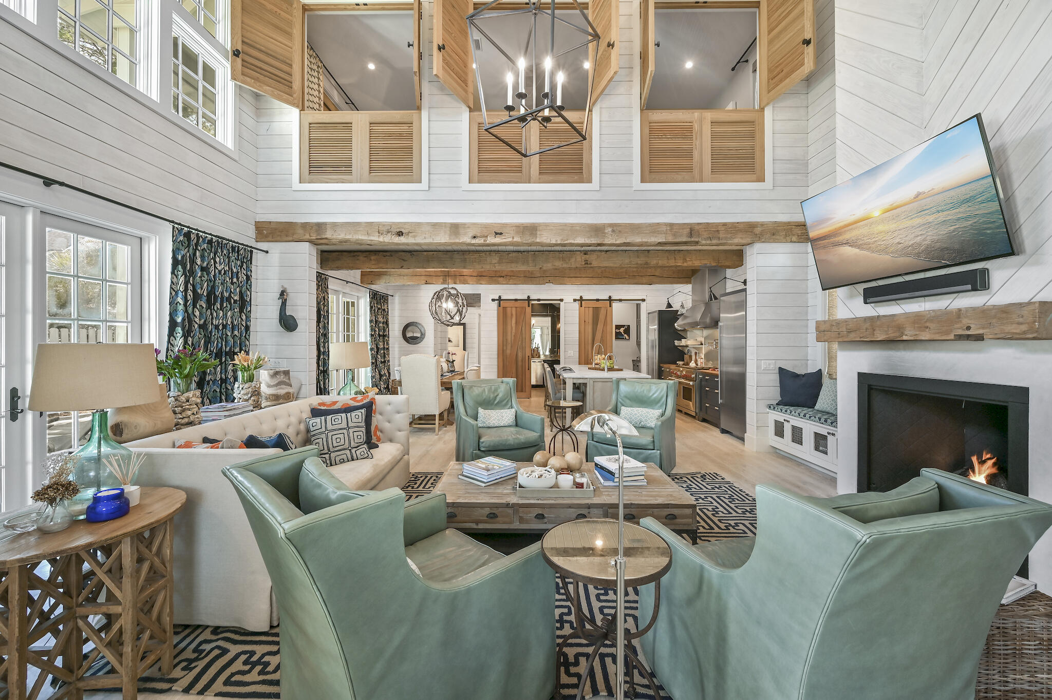 As featured in HGTV and published in 30A Style Book, this casually elegant beach home is situated behind the private gates of Watersound West Beach. Gorgeous custom beach home promises a relaxed coastal lifestyle where entertaining is warm and welcoming. This 4 bedroom, 3 ½ bath home and guest house features luxury designer touches from Tracery Interiors of Rosemary Beach, and an open-concept design where the indoor and outdoor living spaces meld together without boundaries. The gourmet kitchen is a chef's dream and reflect the owner's deep culinary roots with a massive Wolf gas range, two full-sized Sub-Zero refrigerators, and a walk-in butler's pantry. Enjoy the ultimate beach lifestyle at St Joe's exclusive Watersound Beach Club, 40K member initiation fee is included at closing. Two fully equipped wine cellars inside an exquisite bar room tucked behind custom cedar barn doors. Peacock pavers accentuate indoor outdoor living perfectly. The dining area has and array of French doors that swing open onto the pool terrace, while the living room glass doors fold open to allow the space to engage the screened porch for outdoor dining. The second floor of the house is devoted entirely to a generous Master suite with custom cedar privacy shutters, a media chaise lounge, and a luxurious spa bath with wall-to-wall Italian marble, deep soaking jetted tub and standalone his/her showers. There are two guest rooms on the main floor that share a double vanity jack-and-jill bathroom. Designed to maximize privacy, this custom home was designed for guests to have their own luxury space in the carriage house, leaving the main home a sanctuary, opened up for entertaining and pool side gatherings! The private detached carriage house offers  another full bedroom, a sleeper sofa and bathroom for your weekend house guests. If you are an electric car enthusiast, the Seller has a built in charger for a Tesla. West Beach owners enjoy one of the most expansive beaches on 30A, along with nature trails, dog parks and a heated community pool. This house is sold furnished, with some owner exclusions, and can be viewed by appointment only.