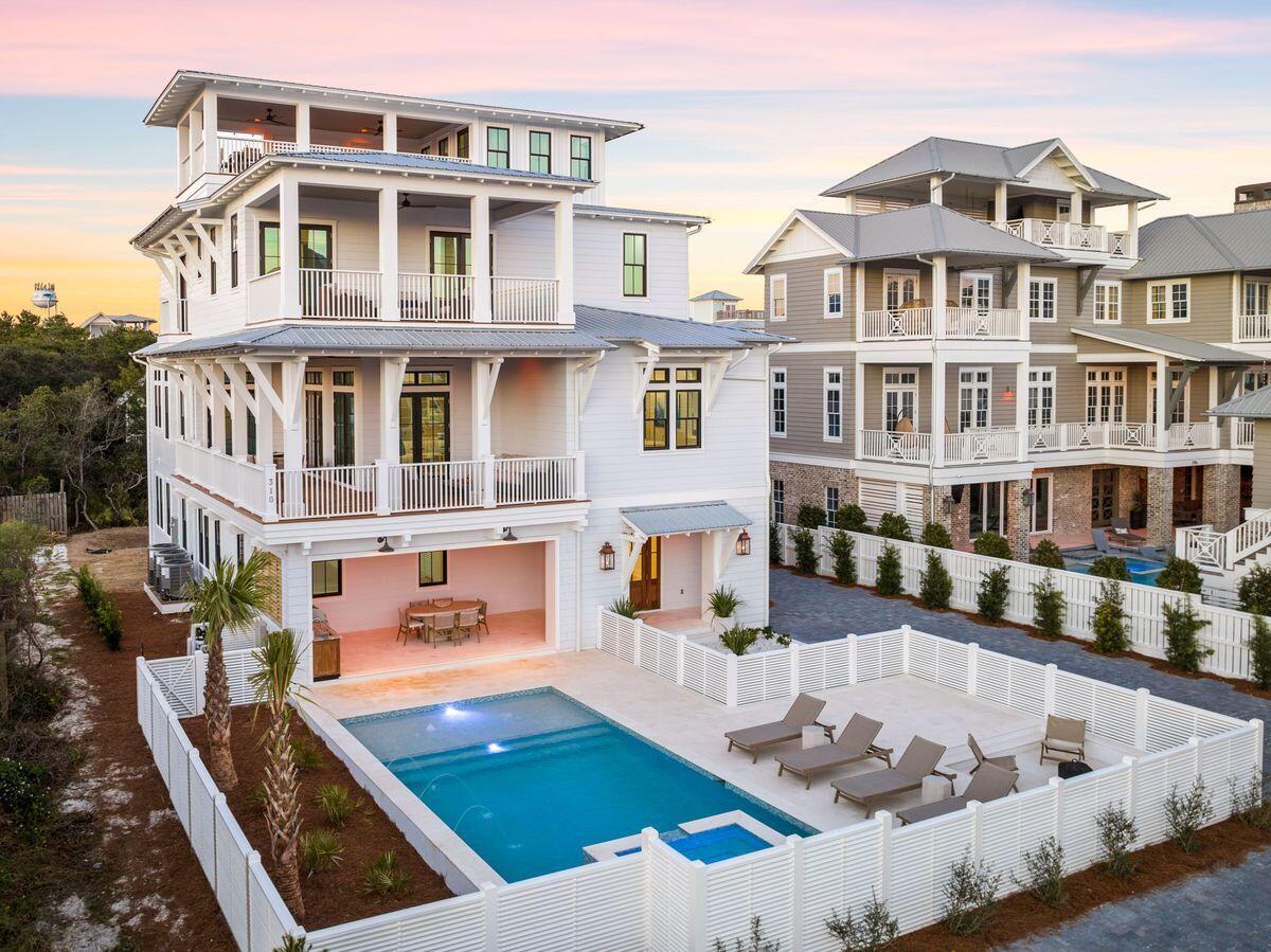 Prominently located in the heart of Inlet Beach, this stunning four-story architectural marvel offers panoramic views of the Gulf Coast from every vantage point. Boasting an array of luxurious amenities, this newly constructed residence epitomizes coastal living at its finest.
Elegance meets functionality with the inclusion of an elevator, opulent marble bathrooms, and a sophisticated Design and Dwell furniture package. The residence also features washer dryer rooms on 3 levels, abundant parking, and a private oasis complete with a refreshing pool and inviting hot tub.
Expansive decks adorn each floor, providing idyllic settings for relaxation and social gatherings. With six bedrooms plus a bunk room, there's ample space for both owners and guests to unwind in style. The grand mahogany front door sets the tone for the lavish interior, where two bedrooms and a spacious living area grace the ground level alongside a convenient two-car garage.
Ascending to the second floor, a living room with soaring 12-foot ceilings welcomes you, offering breathtaking water vistas through oversized Sierra Pacific windows. The kitchen is a chef's dream, boasting Wolf and Sub-Zero appliances, Calacatta Vincenza quartz countertops, and a generous island perfect for culinary endeavors. A well-appointed living room bar adds a touch of elegance, while the primary bedroom retreat beckons with glass doors opening onto a terrace and a luxurious ensuite featuring a freestanding tub and marble walk-in shower.
Continuing upwards, the third level offers additional bedrooms, each with its own bath, seamlessly connected by shiplap accents. For unparalleled views, take the elevator to the fourth-floor lookout, where panoramic vistas stretch from Panama City Beach to Destin.
Outside, sophisticated landscaping creates a private sanctuary for outdoor enjoyment, featuring a captivating pool, custom fire pit, and essential outdoor kitchen ideal for entertaining. Situated just steps from the white sandy beach, this remarkable home offers easy access to the vibrant amenities of Rosemary Beach and the 30A area, making it an ideal retreat for discerning buyers seeking luxury and convenience.
With projected annual gross rentals of approximately $360,000 from two reputable companies, this extraordinary beach house presents a lucrative investment opportunity in addition to its undeniable charm and allure.