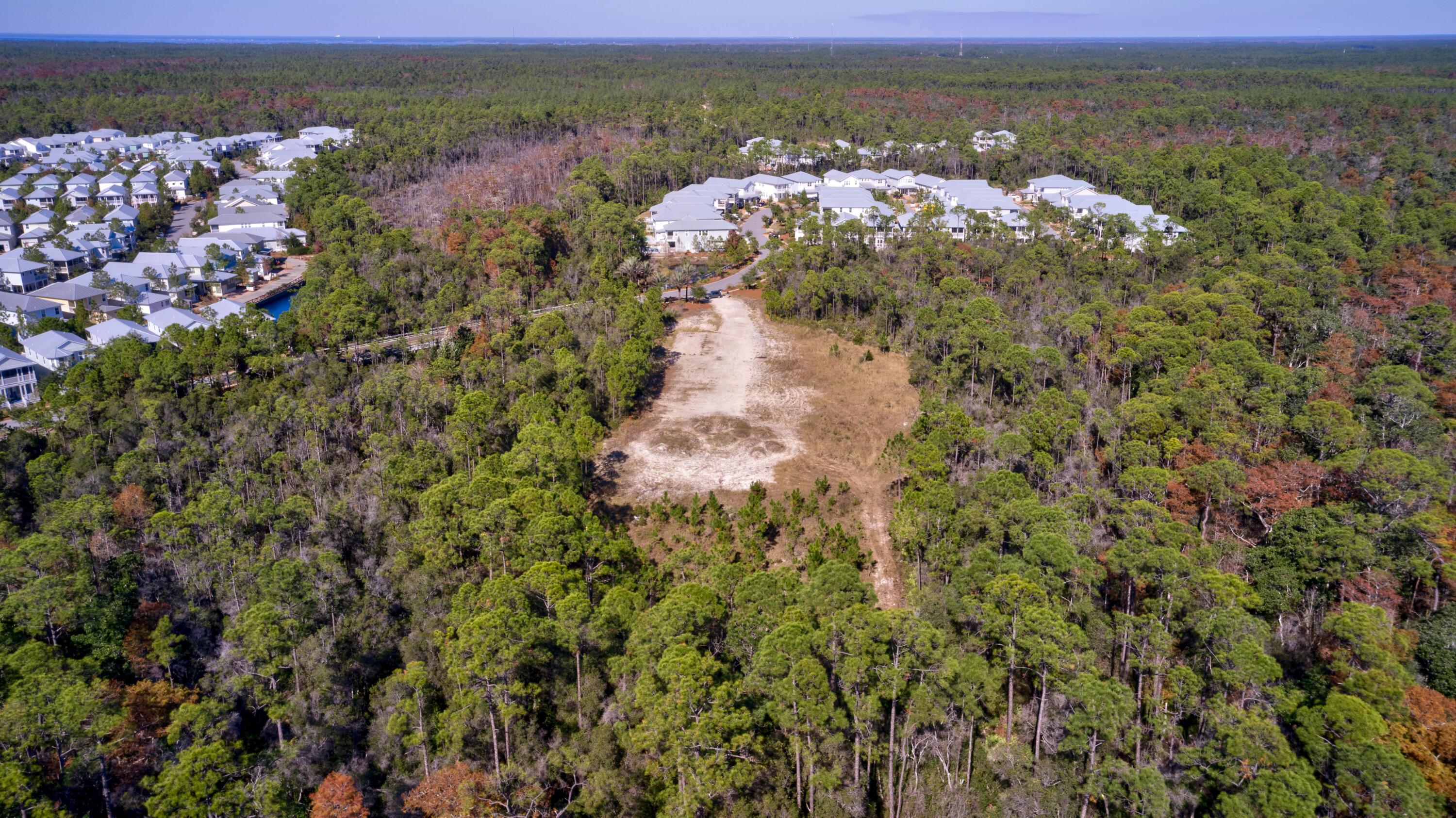 Truly PRIVATE 30A ESTATE LOT or ...Once, in a lifetime DEVELOPMENT OPPORTUNITY in the pristinely beautiful NatureWalk Community Development District. LOCATED IN THE HEART OF SEAGROVE BEACH. This would also make an amazing PRIVATE ESTATE Parcel is  NOT part of the HOA and are zoned mixed use/ multi family.  Previous development order for townhomes was approved in Walton County, but will need renewing.  Tract I is 2.63 acres Close to beach access at San Juan. https://www.flexmls.com/share/DX8G0/107-Mosaic-Oaks-Circle-Santa-Rosa-Beach-FL-32459 Properties would also make great Beach Estate Homesites. Sellers may consider separating out parcels. Price includes all CDD fees paid.