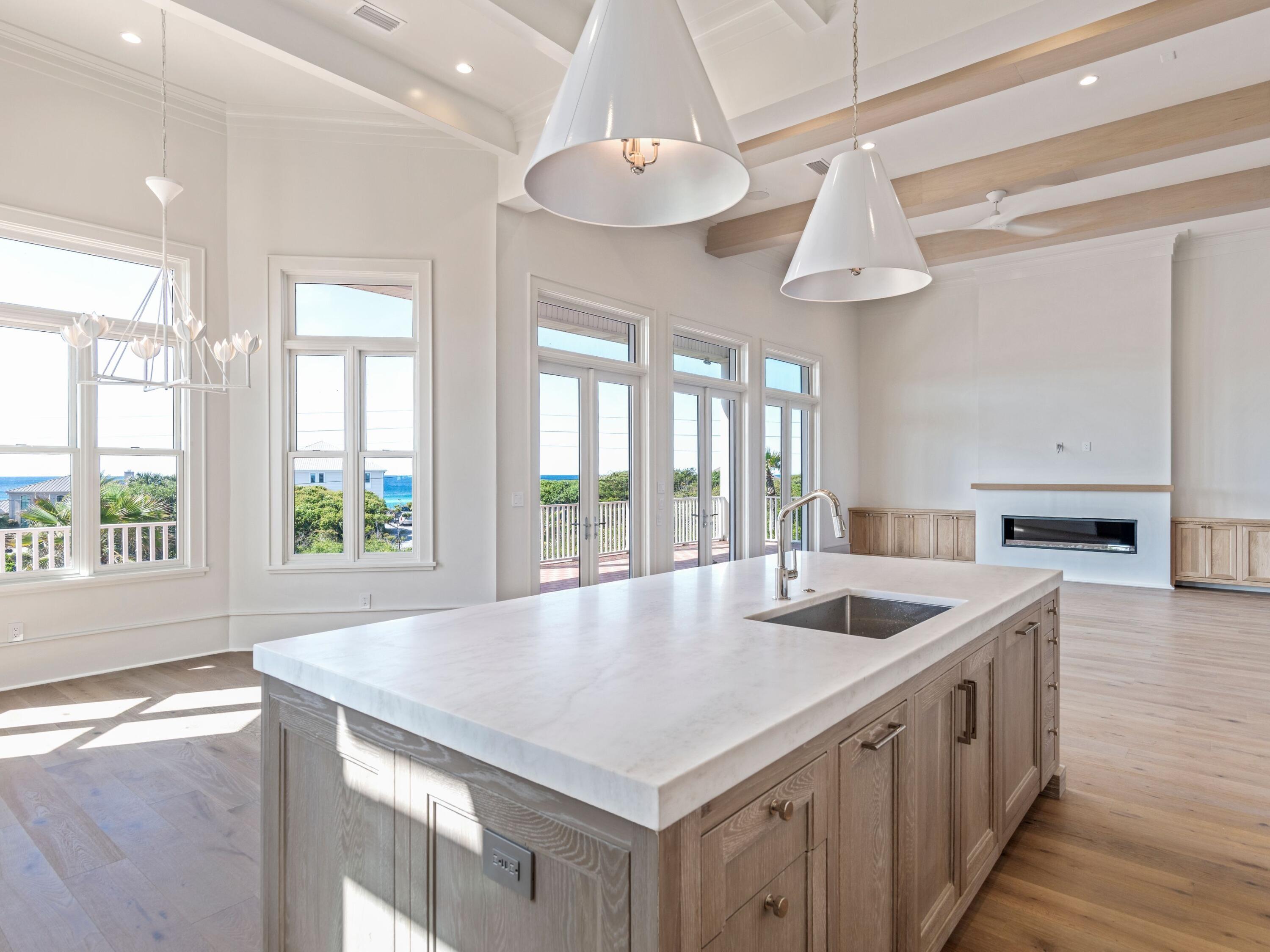 Experience endless gulf views in this pristinely remodeled concrete beach home that is situated on one of the best locations in all of 30A. It's quietly nestled behind the gated beach community of BellaMar with deeded beach access. With this prime location situated on top of nearly an acre lot, the 4 bed, 4.5 bath, 3,734 square foot home boasts fantastic gulf views from every floor. The home has been meticulously renovated from top to bottom with refined luxury, including: white-oak hardwood floors throughout, white-oak accent ceilings, custom beam work, marble tile bathrooms, gourmet appliances, solid-hardwood inset custom cabinetry, all en-suite bathrooms, designer tile selections, 14' ceilings and so much more. Adding to the luxurious privacy, this home sits on a uniquely oversized lot measuring in at .72 acres and providing plenty of room for any future expansion or outdoor design opportunities.

Walking up to this elegant home, you're welcomed by flow-through views of the gulf, and upon entering, are sure to be wowed by this open floor plan that flows seamlessly through the living room, kitchen/dining room and draws you to the deep outdoor patio space that spans the entire width of the home. The first floor features all open living, a private master suite, an office and an additional bedroom and bath and 2 car garage. As you move upstairs, you'll find two additional bedrooms with en suite baths, and extra storage space.

This is a true designer home that has been constructed with the finest materials and is sure to please. The gated community provides protection from short term rentals, which allows true peace and quiet with easy access to the beach with less than a 2-minute walk. BellaMar is an exclusive, non-short term rental community located within quick walking distance to many fabulous local amenities including Gulf Place, restaurants, shopping, and even Santa Rosa Golf and Beach Club.
