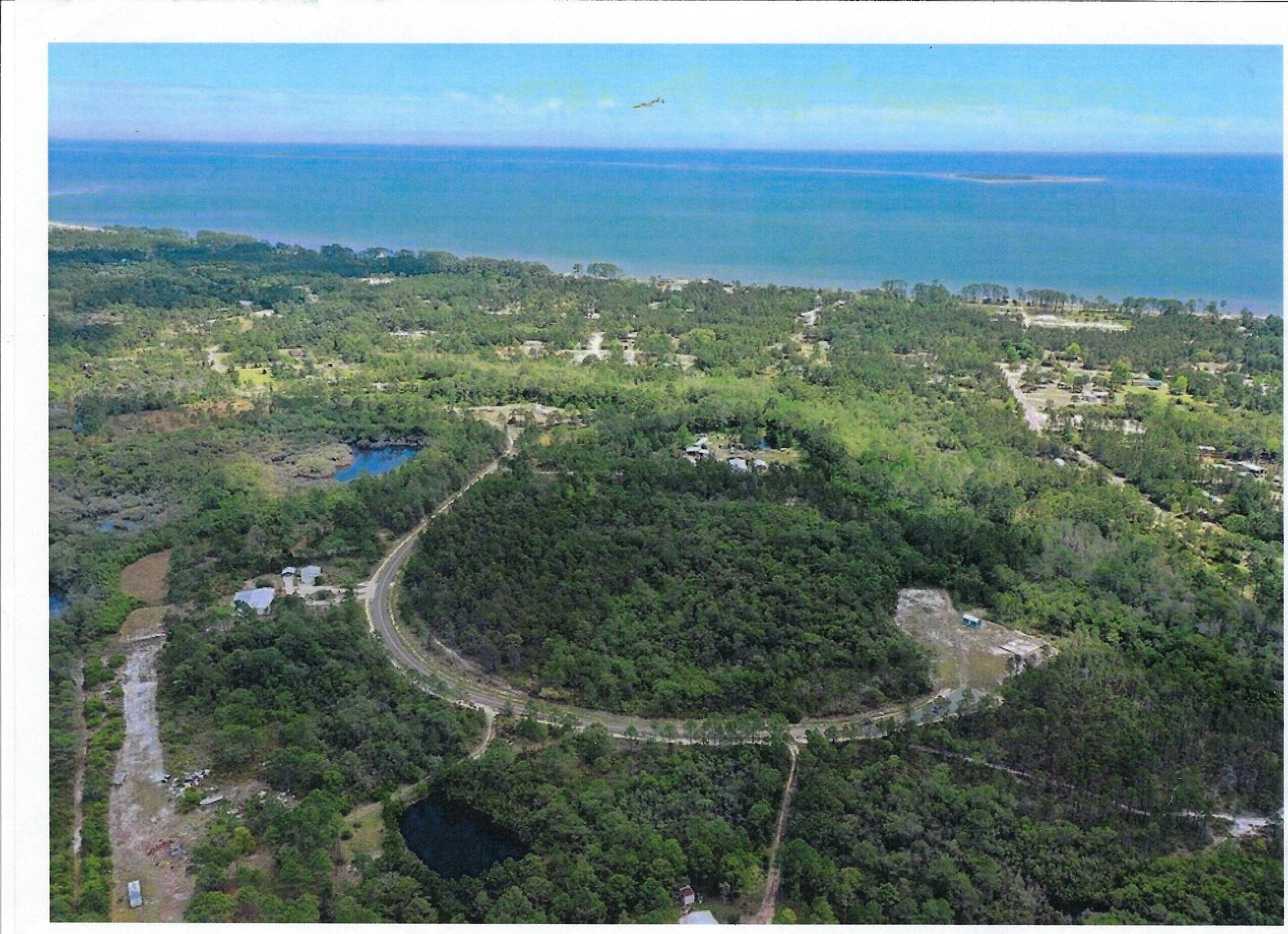 Great 1 acre property for home or vacation house or fish camp, set 1 mile appx from the Gulf of Mexico.  No HOA!!  Property lies 2 miles from Carrabelle Beach.  Land has been deforested, only a small portion in the rear of the lot has minor forestation.  Cleared land has grass planted.  There are both water and sewer hookups already on the property.  Duke Energy  has a pole near the property and a fire plug is within 50 feet of the property.  The land is flood zone X.  Also, this is a Cull-de-sac Road, so it is a peaceful area.  All measurements are estimates.