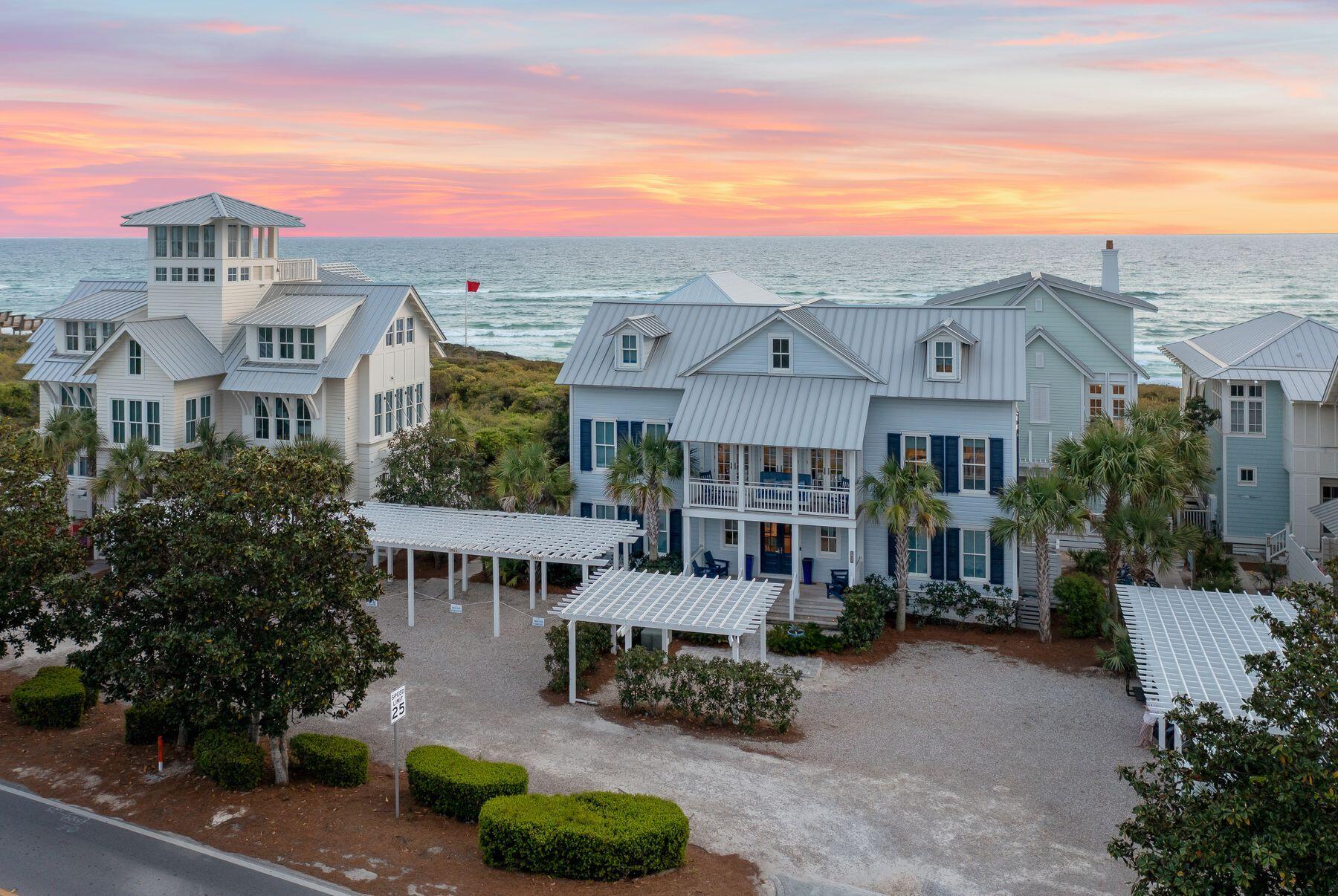 Situated in the heart of WaterColor's Gulf District, this stunning beachside home underwent a complete transformation in 2018, offering a blend of coastal elegance and modern comfort. Boasting panoramic gulf views, this three-story retreat is ideal for those seeking the ultimate beachside escape. 

Step inside to discover a professionally decorated interior, where every detail exudes sophistication. The first floor welcomes you with a spacious living area, perfect for family gatherings and game nights. A converted screened porch now serves as a convenient sand and laundry room, complete with double-stacked washer and dryer units and an ice maker. 

The home features five bedrooms, including two master suites, and can accommodate up to 12 guests. First-floor bedrooms include a king suite with a private bathroom offering a single vanity and walk-in shower. An adjacent bedroom offers two twin beds with an ensuite bathroom featuring a walk-in shower. Completing the sleeping accommodations on this level is a bedroom with two sets of twin bunk beds and a private bathroom with a walk-in shower, along with a convenient half bathroom. The gourmet kitchen, equipped with top-of-the-line appliances, is a chef's delight, while the adjoining living area offers a cozy retreat after a day at the beach. 

Ascend to the second floor to find another master suite, a secondary living room and a generously sized kitchen with a wine cooler, oven, refrigerator and range stovetop. Relax on the front balcony's porch swing or dine alfresco using the grill on the rear balcony, overlooking the gulf. 

On the third floor, the second master suite awaits, boasting breathtaking views and a lavish ensuite bathroom with a freestanding tub. Another washer and dryer add convenience to this level. Unwind in the private media room or step onto the balconies to savor the coastal breeze and stunning vistas. 

With access to WaterColor's private beach and amenities, including pools and recreational facilities, this home offers an unparalleled retreat for full-time living, vacationing or rental investment. This home's new owners can be part of the beach-sharing agreement in place with gulf-front homeowners. Included in the purchase of this home is the opportunity to be included in a beach-sharing agreement with gulf-front homeowners, giving you access to the private beach on Beach Lane. 

Experience seaside serenity at its finest in this exquisite and well-amenitized WaterColor residence.