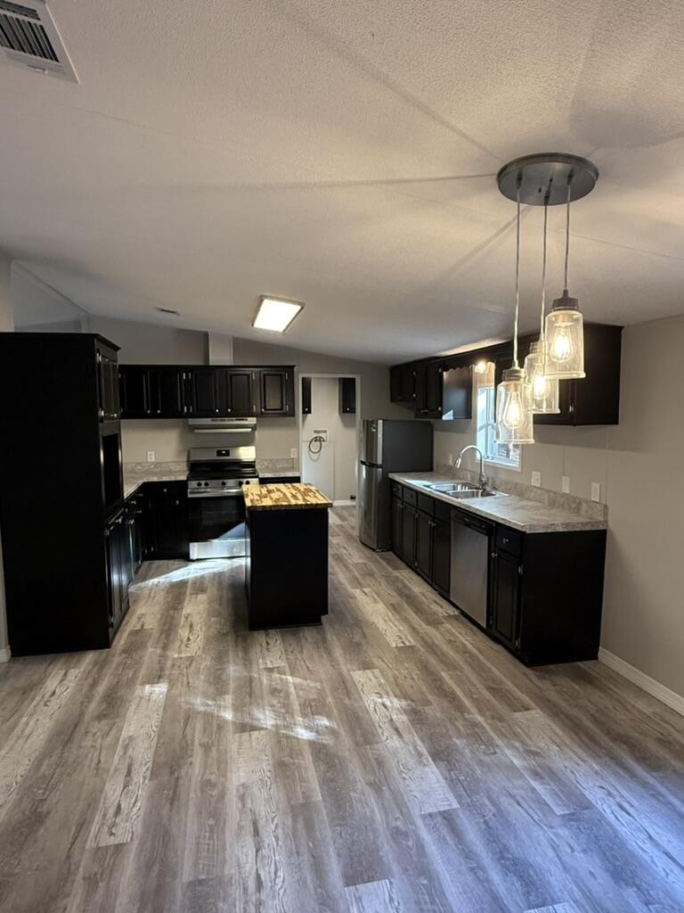 Welcome to this beautifully updated 3 bedroom, 2 bathroom mobile home on a 1-acre lot. This home features a bright and open floor plan with brand new flooring, fresh interior paint, and updated fixtures throughout. The kitchen is equipped with new appliances and offers ample cabinet space, making it both stylish and functional. All bedrooms are well-sized with comfortable layouts and natural light.

Enjoy peaceful country living while still being just a short drive to nearby conveniences. Whether you're looking for space for a garden, outdoor activities, or future additions, this property offers endless possibility. Move-in ready and waiting for its next owner—don't miss this one!