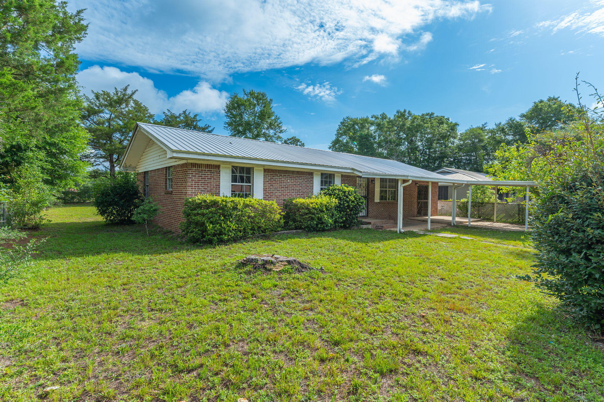 Available Feb. 1st, 2026 - This well-maintained 3-bedroom, 1-bath home in the heart of DeFuniak Springs offers a versatile bonus room that can serve as a second living area, home office, playroom, or even a fourth bedroom to suit your needs. Enjoy the privacy of a fully fenced yard—perfect for children —as well as the convenience of a covered carport. Located just minutes from schools, shopping, and local amenities, this home combines comfort with accessibility. Rental requirements include a minimum credit score of 600 for all adult occupants, at least one year of consistent employment, and a monthly household income of at least 2.5 times the rent amount. Application required including credit report & background screening.