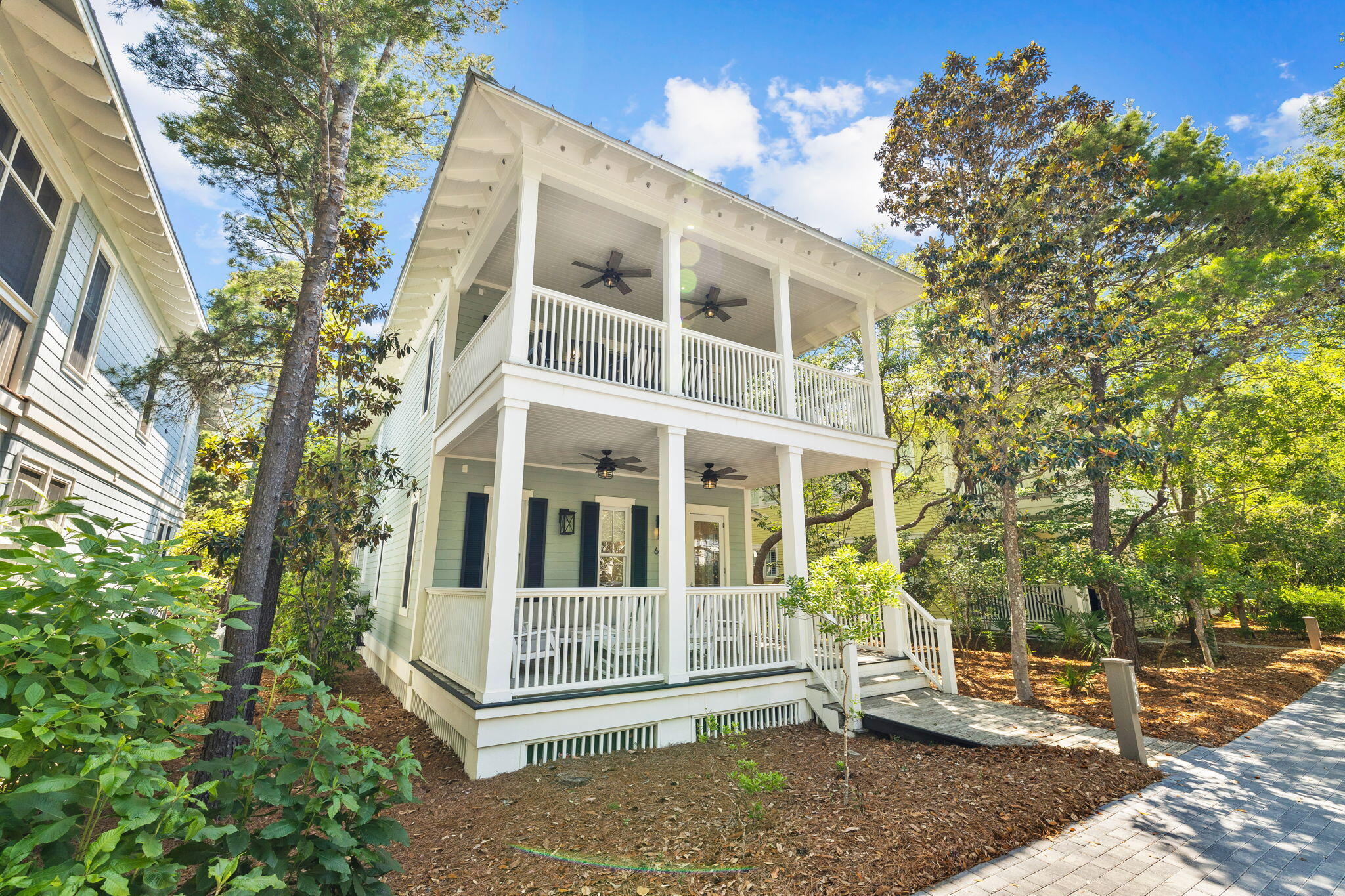 Located in the prestigious WaterColor Lake District, this exquisite luxury home offers a unique blend of comfort and elegance, just a short walk from the exclusive Beach Club. Expertly remodeled by the renowned Borges Brooks builders, this property exemplifies upscale living with its high-end finishes and thoughtful design.

The heart of this home is its entertainer's kitchen, beautifully remodeled to include high-end stainless steel appliances, a 48-inch Wolf range with grill, a 36-inch Sub-Zero refrigerator, wine cooler, and a large breakfast island. This space opens to a bright sitting/TV area and a dining area, all adorned with soothing pastel decor, tall windows, custom artwork, and gleaming flooring. Outdoor living is equally impressive, with a screened back porch featuring a family-sized dining table, a gas grill, and an outdoor shower. The two master suites elevate the luxury experience. The first-floor suite boasts a free-standing tub, mosaic tile flooring, and a walk-in shower, while the second-floor master suite features a unique bathroom with stone walls, a walk-in closet with built-ins, and a private balcony.

Additional amenities include a cozy sitting area with a flatscreen TV at the top of the stairs, an adjoining covered porch with treetop views, a bunk room, laundry facilities, and an extra guest bedroom, ensuring comfortable accommodation for family and friends. 

The property's location invites a lifestyle filled with activities like swimming, fishing, and water sports at the beach or on Western Lake, as well as exploration along boardwalks and nature trails. Sold turnkey, this home includes all meticulously selected furnishings, decor, and appliances, making it an outstanding opportunity to own a slice of the 30A lifestyle with great potential in the rental market.