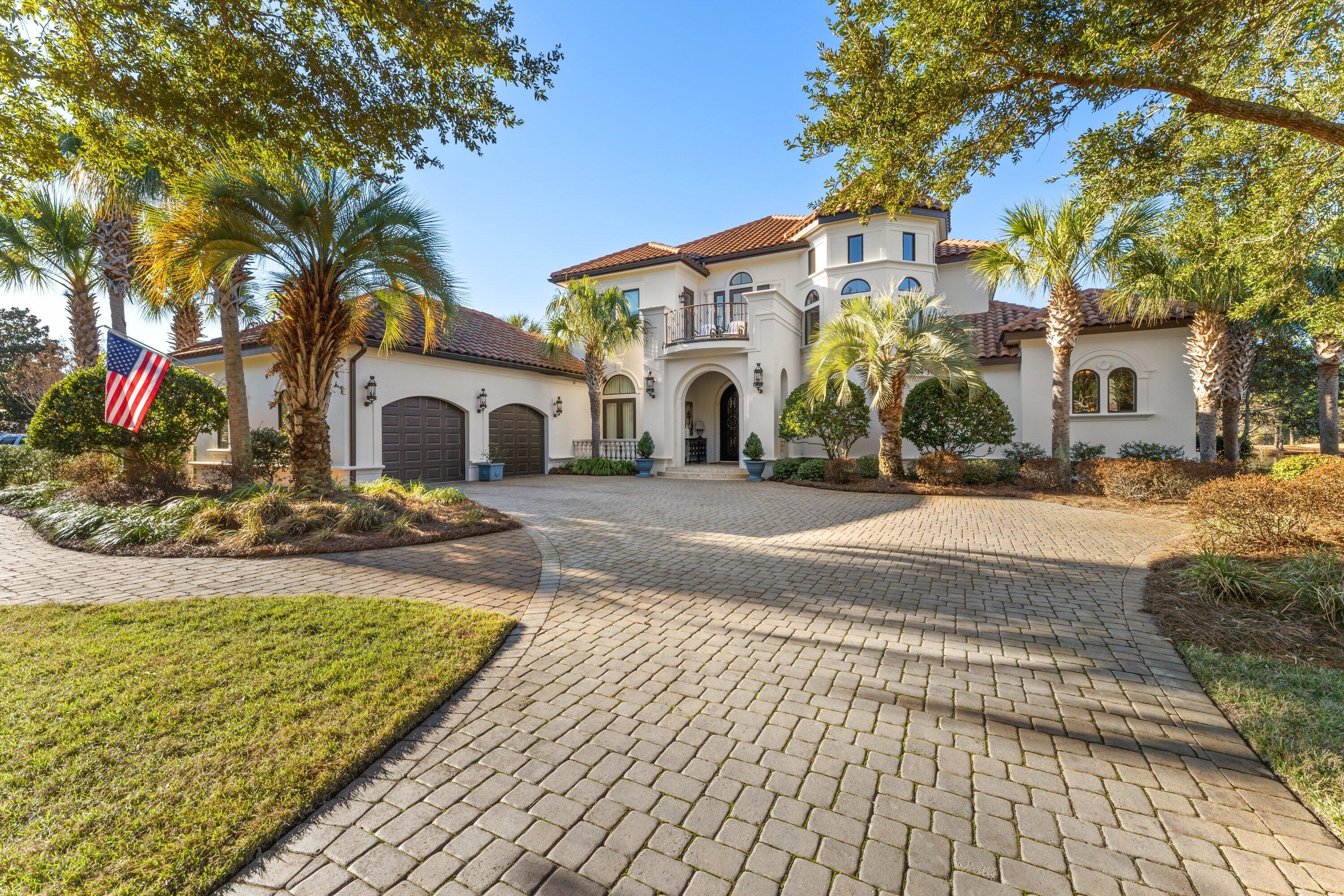 This Elegant Custom Estate Home features 4 spacious bedrooms and 5 baths. A warm and inviting 2 story foyer greets you with views of the salt water pool, lake, and golf course. The spectacular entrance is accented with soaring ceilings, formal living area, fireplace, and a wall of glass windows providing for tranquil pool and golf course views. The temperature controlled wine cellar is nestled beneath the curved, entry stairway. The gourmet kitchen features custom cabinetry, granite countertops, top of the line appliances, kitchen island, tile backsplash, recessed lighting, and spacious walk in pantry. This well designed floor plan conveniently situates the Master Suite on the main level, offering privacy, generous square footage. and easy access to the pool through the double french doors. Also located on the main level is a separate great room, extra guest suite with full bath, and the expansive Outdoor Kitchen and Living Area. Upstairs you will find two additional bedrooms, each with their own full bath, and a study with built in cabinetry. The new owner will enjoy the beautiful southwest sunsets from this lovely home, as well as ample parking with two car garage, and separate golf cart garage entrance.