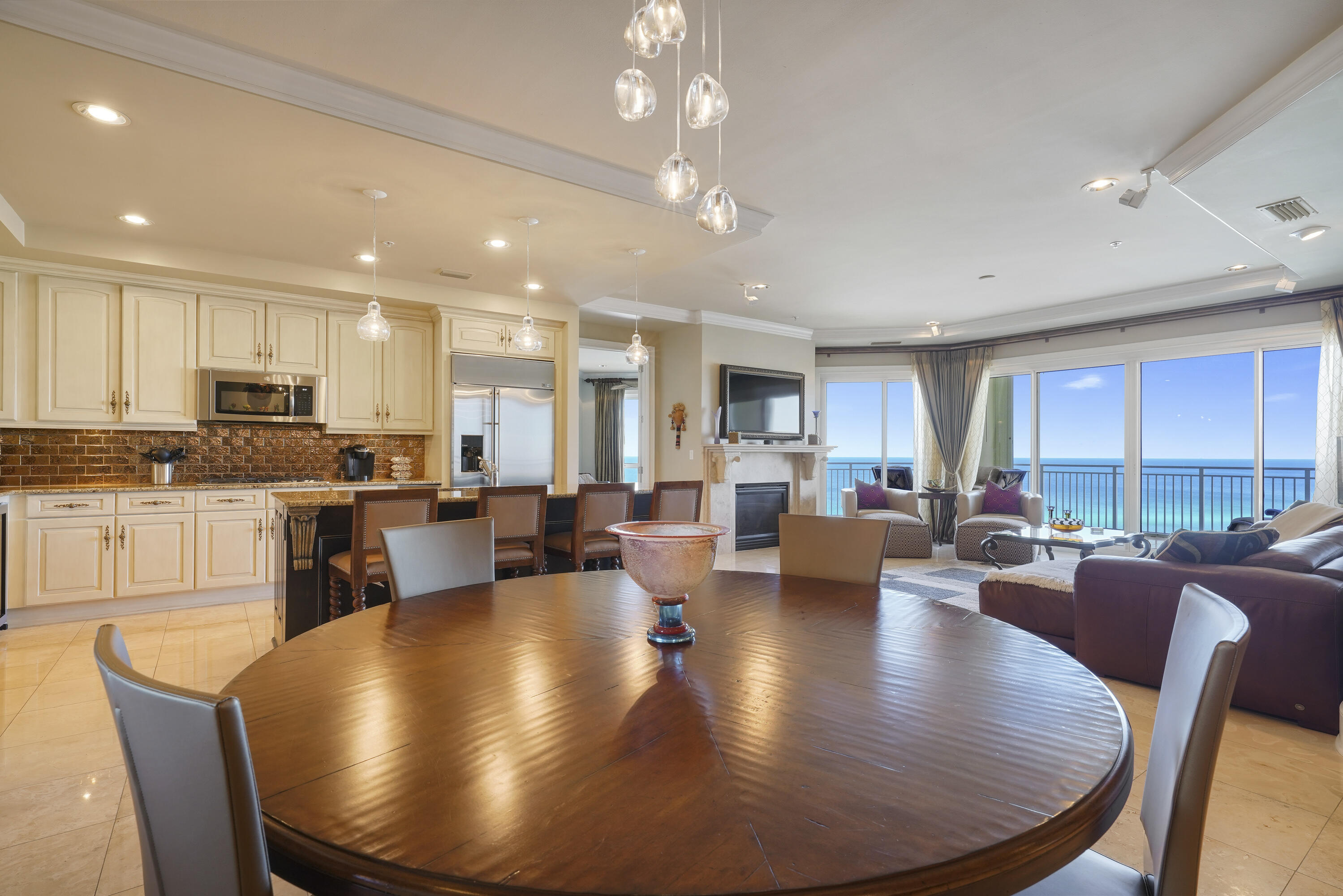 From the moment you arrive, this spacious three bedroom, three bath gulf front villa at Grand Dunes offers a rare opportunity to create your own vision of refined coastal living. Located on the tenth floor, the villa enjoys sweeping, uninterrupted views of the emerald waters and sugar white sands that define the Miramar Beach shoreline. With 2,320 square feet of thoughtfully designed living space, every room is positioned to take full advantage of the breathtaking Gulf views, including all three bedrooms. The villa is offered furnished, with select artwork and personal pieces excluded, and welcomes you through a private entry foyer into light filled interiors framed by expansive views. Generous 9.5 foot ceilings and tall interior doors enhance the open feel, while a blend of polished travertine and hardwood flooring provides a timeless foundation. The living area features a natural gas fireplace with a limestone surround and integrated surround sound, creating a comfortable space for gathering and relaxation.

The kitchen is well appointed with granite countertops and bar, custom cabinetry, and a premium stainless steel appliance package. Highlights include a double oven, 5 burner natural gas cooktop, wine cooler, "Scotsman" crushed ice maker, and an oversized pantry with roll out shelving, offering both function and flexibility for personalization.

The gulf front primary suite and guest spaces provide privacy and direct water views, while the baths feature seamless glass showers and quality finishes. A custom dry bar in the gulf front guest room or office adds versatility to the floor plan.

Additionally, the HVAC system was replaced in 2023 and the hot water heater in 2019, providing improved comfort, efficiency, and lasting peace of mind.

Step outside to the expansive gulf front balcony, offering more than 350 square feet of outdoor living space. With ample room for seating, ceiling fans, a built-in natural gas grill, and hurricane shutters for peace of mind, this balcony is the perfect place to enjoy sunsets, sea breezes, and the calming sound of the waves.

Grand Dunes boasts exceptional amenities: ultra-quiet interiors, semi-private elevators, 24-hour security, gated entry, lush landscaping, two levels of gated underground parking, a private heated pool, an Owner's Lounge with Fitness Room, guest suites, 200' of deeded beach, a Gulf-front lagoon-style pool with a sparkling waterfall, and premium beach service.

Grand Dunes is the "Emerald Coast's Most Desired Rental Restricted Beachfront Development"

Call us today to set up your private viewing of this beautiful Villa today!