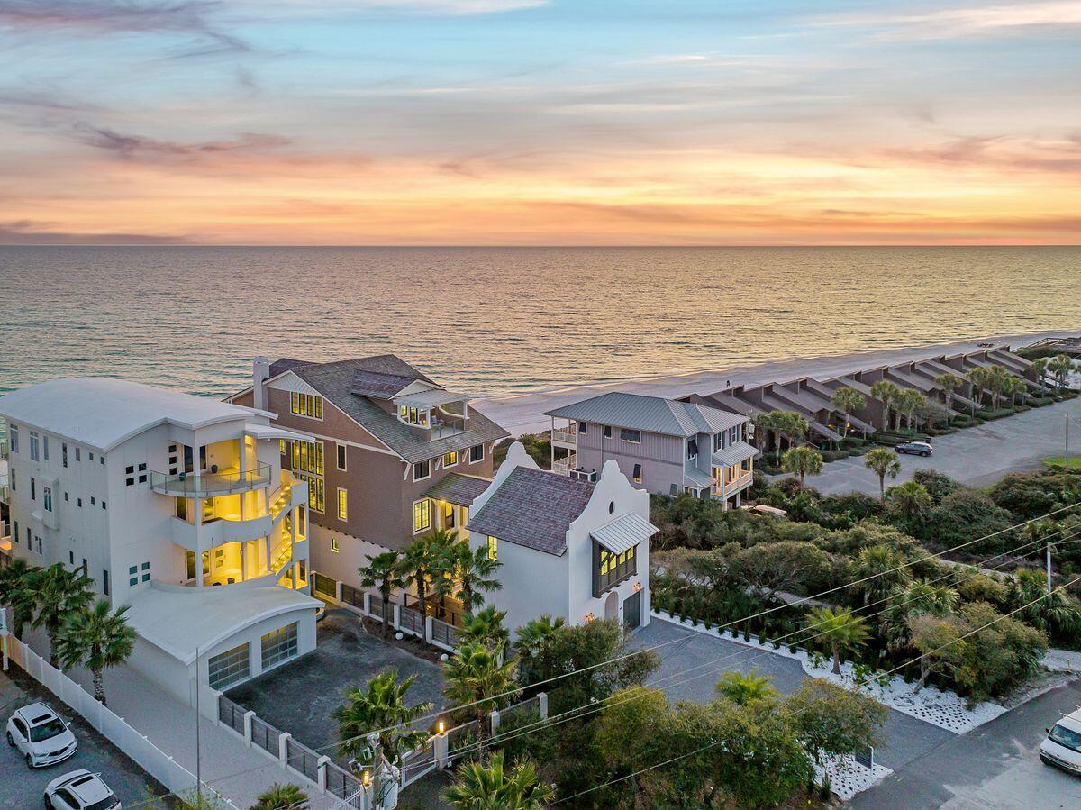 Extraordinary new construction with prolific architectural styling situated on 50' of premium gulf frontage adjacent to Alys Beach and Kaiya in the heart of east 30A. This sprawling compound is characterized by a coastal modern design exceptionally rendered by Chris Stoyles at Archiscapes with interiors curated by Cronk Duch out of West Palm Beach, FL featuring notable upgrades including an impressive four story vertical footprint taking full advantage of unparalleled gulf front vistas as well as a sizable gulf front pool perched at over 30' above sea level offering a optimal privacy and serenity. The property boundary for this home (50' x 400') extends from 30A to the mean high waterline of the Gulf of Mexico and is designed to be a compound with a sprawling vertical layout to maximize extensive gulf views from four finished levels. This home was curated for primary or secondary living situated on a strategically chosen homesite within walking distance of Alys Beach & Kaiya Beach Resort offering an immense array of private amenities and seclusion that is rarely available on 30A. Notable features include an oversized two car garage with a double height ceiling to accommodate multiple vehicles & additional storage per stall, oversized private parking court and adjoining carriage house as well as ample indoor and outdoor living spaces including a first floor bar & suspended glass encased wine cellar as well as an adjacent living room framed by floor to ceiling glass windows (12' ceilings) overlooking a private resort style pool with endless views of the emerald green waters of the Gulf of mexico. Once completed, this home will boast a lush, courtyard entryway characterized by gas lanterns and sleek contemporary styling with primary living on the second floor of this home which is accessible from the glass encased elevator with 10' sheets of glass allowing for views as it ascends to each floor. The suspended glass & steel floating staircase also ascends three finished stories with rooftop views that are 80' above the water allowing for panoramic vistas from Destin to Panama City. This property is comprised of 9 bedroom suites including one custom bunk room, nine full bathrooms and one half bathroom all of which is situated on almost half an acre of land. Each floor features it's own separate living area including an adjoining carriage house which offers a home theatre and separate guest suite. Other notable features include reclaimed french oak flooring by Thierry Francois & Co with spanish limestone on the first level and outdoor pool deck, ipe brazilian hardwood on the exterior decking, whole home fire suppression system, poured concrete parapet walls as well as highly detailed finishes & wood detailing throughout. The chef's kitchen is beautifully designed with a  Francois & Co custom hood vent, suspended glass shelving, 48" Wolf (gas) range and SubZero refrigeration as well as a separate scullery with ample storage & additional appliances including a built-in Wolf coffee maker and secondary dishwasher. 8854 E Co 30A is prominently located near Camp Creek Golf Course, Alys Beach and Rosemary Beach on the eastern end of 30A providing easy access to the ECP Northwest Florida Beaches Airport as well as all of the world class shopping and dining that south walton county has to offer.