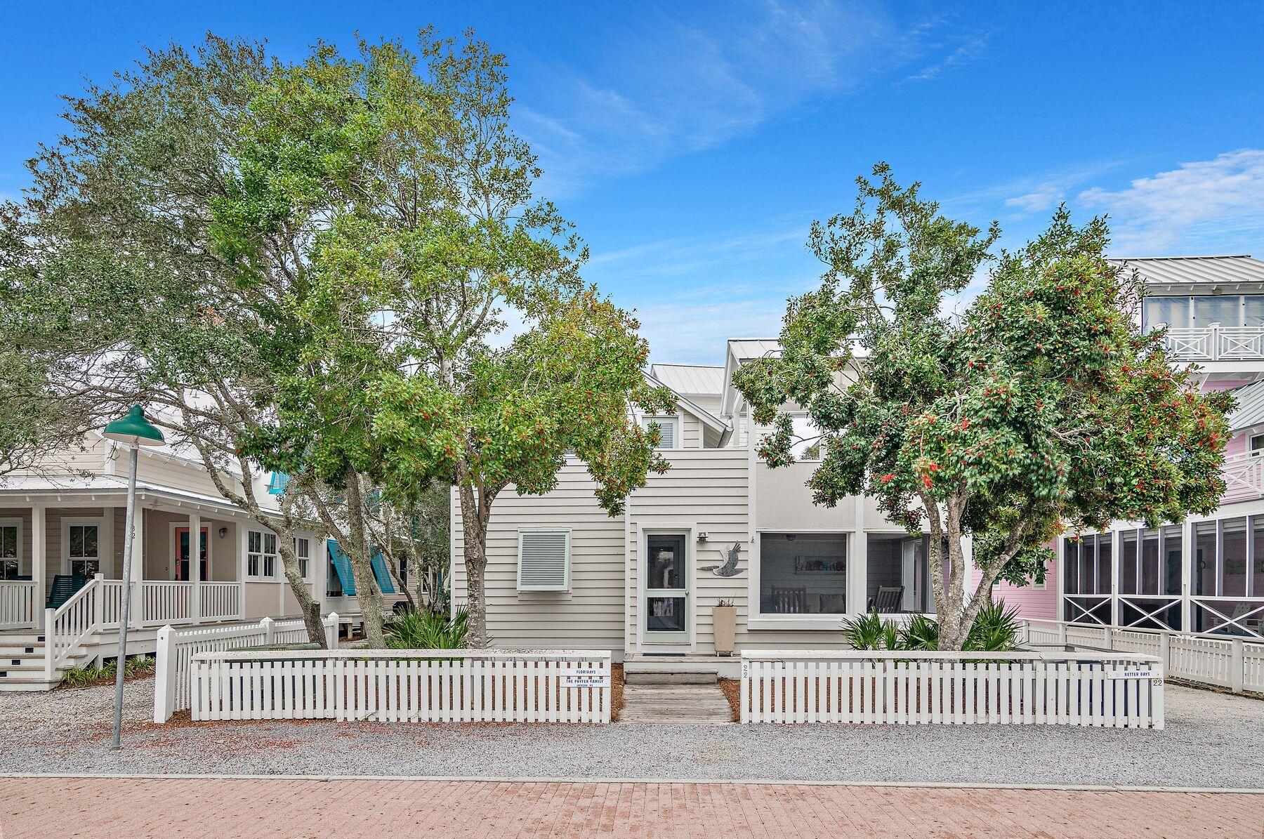 Combining laid-back living with the best gulf views, this Seaside, Florida, cottage has the rare luxury of off-street parking on the rear private driveway. Sitting behind a white picket fence on a generous lot, this attractive home has a beautiful carriage house as well as a new roof and newly painted siding. Step inside and admire the light interior decor, cozy fireplace and lofty ceiling adding a sense of airy spaciousness to the open living room. Wood flooring continues into the dining area and kitchen, which is fully equipped for preparing family meals. Two bedrooms and a shared bath are also on this level. Head upstairs to find two additional bedrooms, two baths (one with a whirlpool tub) and a second living area, allowing families to spread out and enjoy their own space. Sparkling gulf views from the open-air deck make this the perfect space for gathering for sunset drinks with family and friends.  The outdoor space is equally conducive to alfresco dining and relaxing in the rear yard. The separate carriage house provides beautiful accommodation for independent family members with a bedroom, bathroom, kitchen, living and dining space. Just steps from beach access, the home also has access to a community pool, tennis and a shady gazebo. Being in Seaside is a real bonus for shopping, dining and live entertainment in this popular social hub. Ideal as a family vacation home, this well-located cottage has potential rental earnings of $80,000.