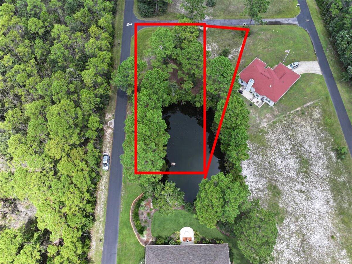 MOTIVATED SELLER! Lots 27 & 28- 1796 W Smugglers Cove Dr & 6301 Smugglers Way Two! 

Discover an extraordinary opportunity to create your dream home in the exclusive waterfront community of Smugglers Cove. Perched gracefully along the edge of the Intracoastal Waterway, this serene neighborhood is tucked away in a setting of natural beauty, where wooded preserves and tranquil ponds provide a sense of peace and privacy that is rarely found. 

Smugglers Cove is more than just a neighborhood — it's a coastal lifestyle destination. Residents enjoy an array of refined amenities, including a sparkling community pool, clubhouse for gatherings, and tennis courts for active living. A private pier and boat launch provide effortless access to the Intracoastal Waterway, while deeded water access ensures owners can enjoy endless days of boating, fishing, paddleboarding, or simply relaxing as the sun sets across the horizon.

The community's natural surroundings create an ideal balance of beauty and convenience, offering a retreat-like atmosphere while still being only minutes from the sugar-white beaches of the Gulf of America, top-rated schools, shopping, dining, and all the best of the Emerald Coast.

This unique offering includes two adjoining homesites being sold together, presenting an expansive canvas for your vision. Complete with home plans and prior septic research, these properties provide added value and peace of mind for the next owner who desires to build with confidence. Whether you envision a coastal-inspired cottage or a grand family retreat, Smugglers Cove offers the perfect backdrop for your waterfront lifestyle.

Please NOTE: Buyer to verify all information for both lots and dimensions. Water Taps have been paid for both lots, but meter has NOT been set. Septic system has NOT been installed. No short term rentals allowed.

Sellers preferred closing attorney Fountain & Bridgeford, PLLC 2045 Professional Ct Navarre, FL 32566

NO SURVEY AVAILABLE