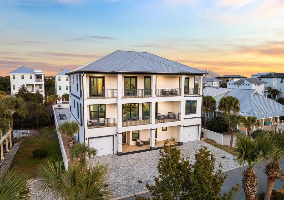 Over $256,000 in rental income for 2026!  AND seller is offering a $325,000 rental guarantee for the next two years!
Imagine floating up to a swim-up cabana bar, drink in hand, while your guests lounge in the in-pool seating as the Gulf Coast sun sets behind you -- this is the backyard that vacation dreams are built on.
The resort-style pool complex is the undisputed centerpiece of this 5,688 sq ft coastal masterpiece -- a sprawling, freeform lagoon-style pool complete with a stunning tiki cabana bar with in-pool seating, a dedicated poolside game room with wet bar, and a private pool bath. Whether you're hosting 20 guests or a quiet evening for two, this outdoor oasis delivers a five-star resort experience without ever leaving the property.  Inside, 8 bedrooms with en-suite baths, hardwood floors, quartz countertops, professional-grade appliances, and frameless glass showers match the luxury the pool promises. A custom bunk room, summer kitchen, multiple covered balconies, and upper-level Gulf views round out a home that performs as good as it looks with over $256,000 in rental income already booked for 2026.
Offered fully furnished and turn-key. Your guests are already waiting.
