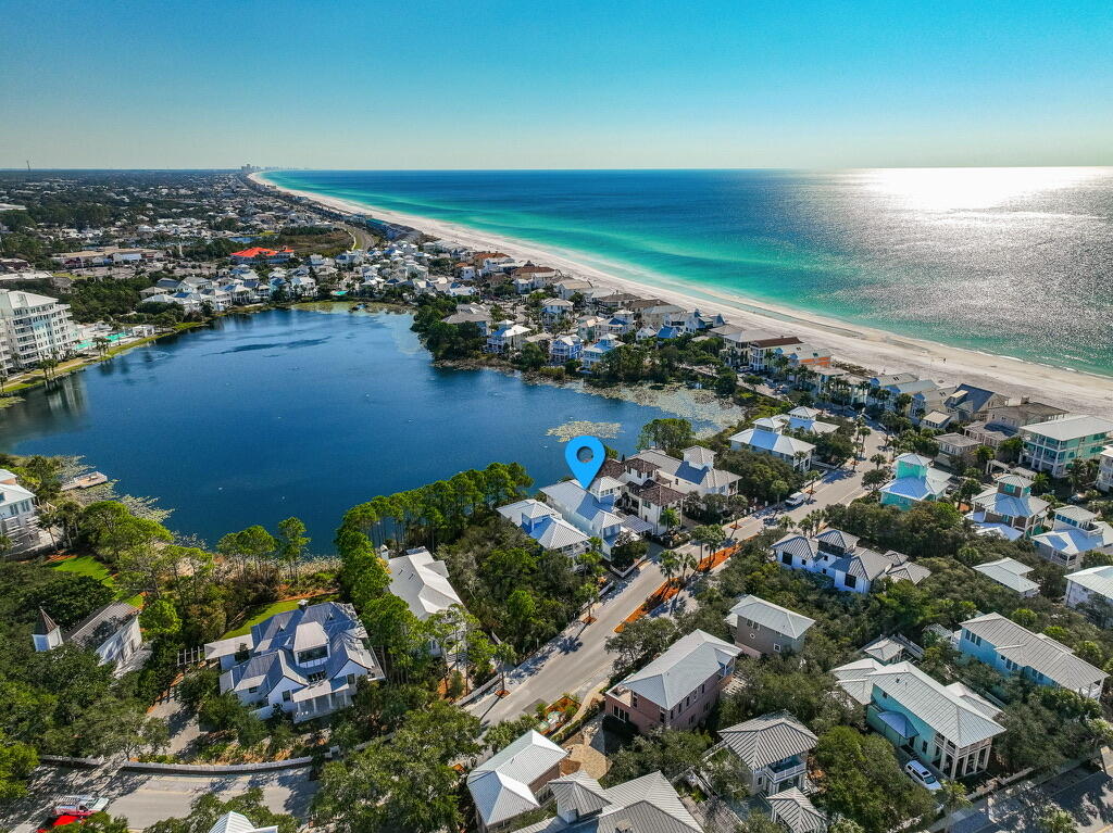 Rarely do homes on the west side of Lake Carillon,     with a one minute walk to the Beach Club Pool AND the beach walkover, come available..  The lake in your back yard offers location,  privacy and views that few Carillon interior homes can match. The first floor boasts a  king master with ensuite.  The open floor plan with kitchen, dining and living areas all offering lake views. The kitchen features high end sub-zero and Viking appliances.. The living area includes a rear screened in porch. The second floor offers 2 more king bedrooms with a second king master ensuite and a king guest suite with added  bunk room and shared bath.  Also , a 2nd floor media/office includes a Murphy bed.  The 3rd floor tower, with pull out sleeper sofa, affords beautiful lake and partial gulf views