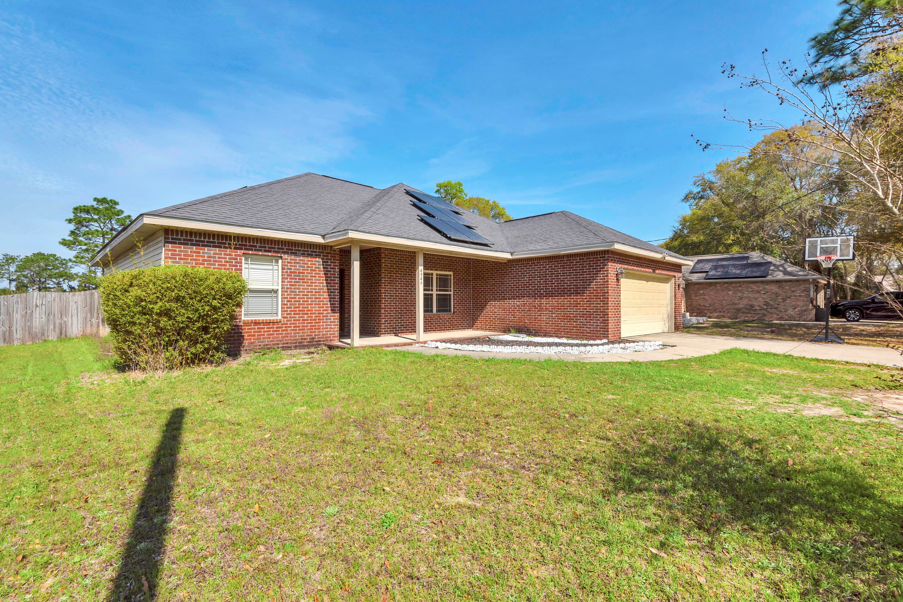 Located SOUTH of I-10 and NO HOA!! This one owner home has been well maintained and features 4 bedrooms and 2 bathrooms. All rooms have 9 feet high ceilings to keep the home bright and light even on the rare gloomy days. Granite counters are throughout. The master bathroom features a double sink vanity, separate tub and shower as well as a large walkin closet. Solar panels were installed and they greatly reduce the power bill. The back yard is completely fenced and backs up to an easement so you don't have a neighbor  right behind. You can't beat the location for access to the bases. All wet areas have large 18'' square tile for ease of cleaning. Schedule your visit soon, a home like this in the ideal location. This home features an ASSUMABLE VA mortgage at 5.65% interest