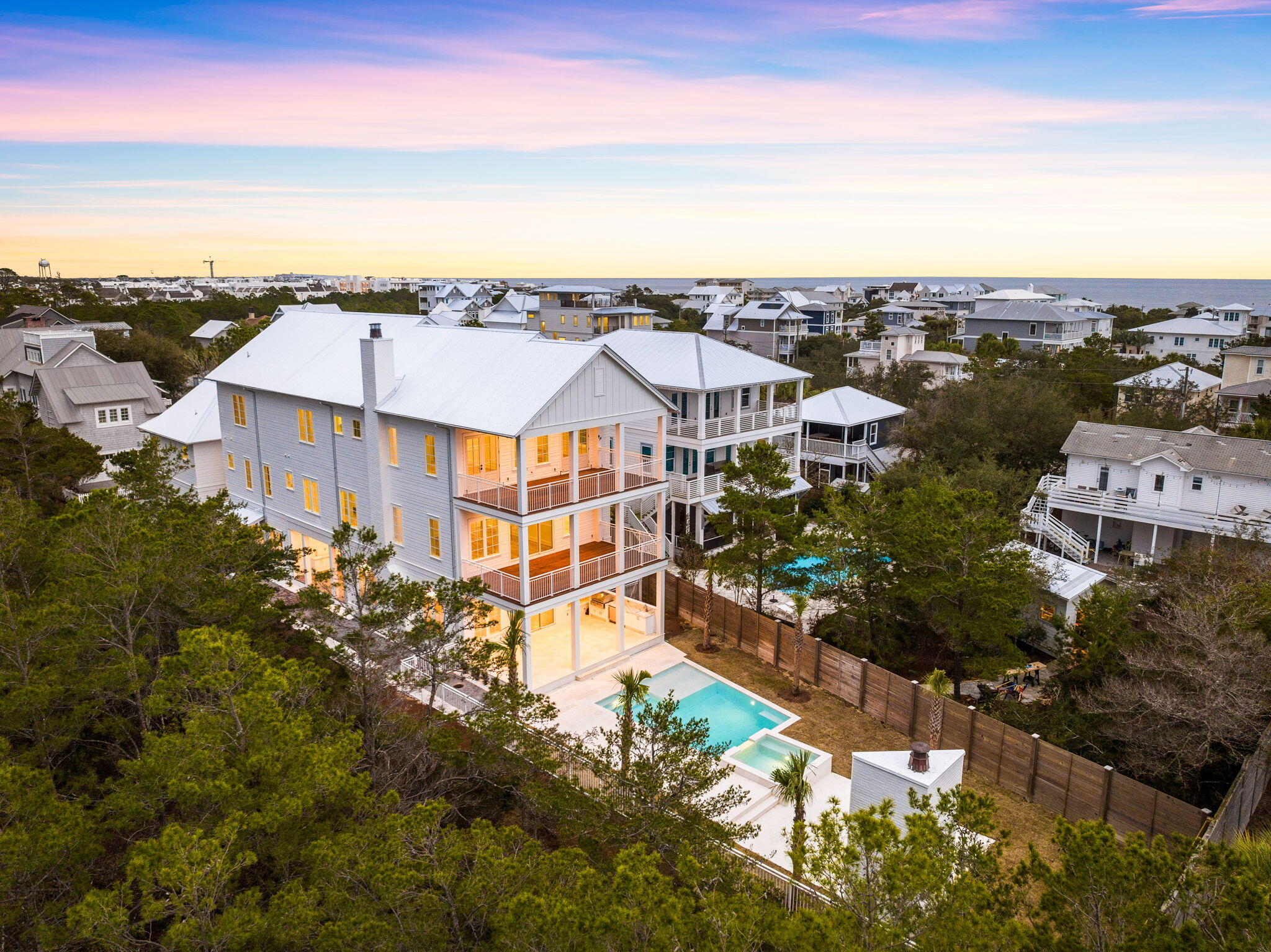 PRICE IMPROVEMENT! Situated on at the end of a private cul-de-sac overlooking the 5th green at Camp Creek golf course, 173 A Street offers privacy rarely found on 30A.  This resort style home features endless luxury amenities including a chef's kitchen, oversized great room, an array of outdoor living spaces, alfresco dining, huge pool, luxury spa, outdoor fire area and so much more! The well-designed floorplan offers living areas on every level, an enormous master suite, 6 junior suites in the main house, a large bunk suite and an attached carriage house with an additional suite. Stunning sunsets over the emerald waters can be viewed from the rooftop deck. 
 
Located within minutes of Alys Beach, Kaiya and Rosemary future homeowners will enjoy all 30A has to offer without getting in a vehicle. Deeded beach access is granted at the end of the street. Do not miss this rare opportunity!