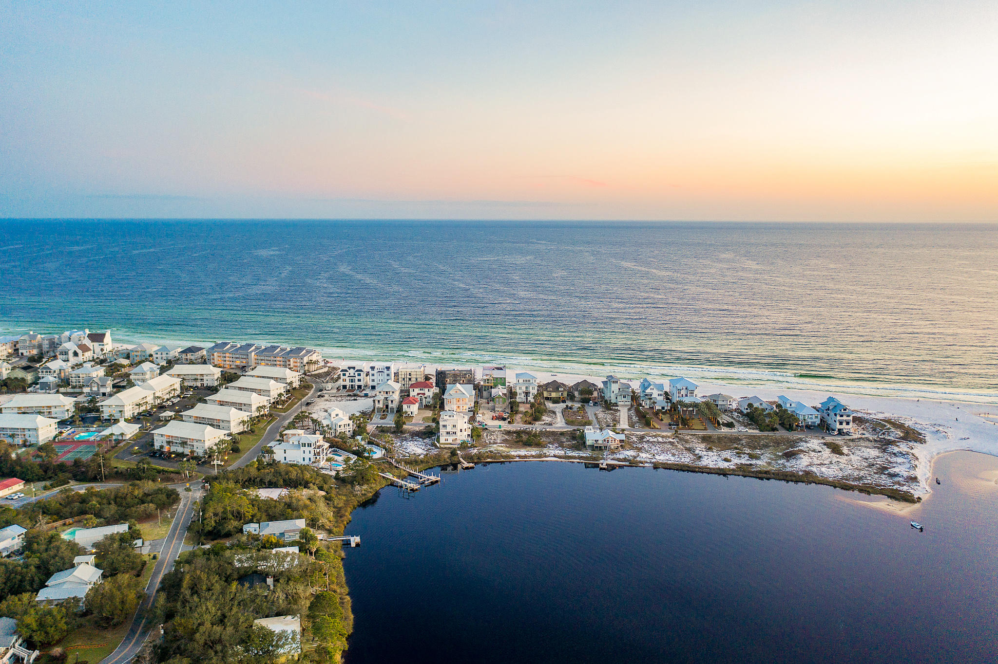 Stunning views of the Gulf of Mexico and Eastern Lake combined with astonishing architecture exemplify this incredible Seagrove property. Ideally located within the heart of Seagrove Beach along sought-after San Roy Road, this estate offers outstanding access to enjoy all 30A offers including the sugar white sands, emerald waters, world-class fishing, first-rate dining and luxury shopping. This exceptionally designed better than new luxury home offers multiple living spaces, six bedrooms, six full bathrooms, one half bathroom, a private garage, ample additional parking, a private pool and an unprecedented outdoor living space. The homesite offers additional space for the future construction of a separate carriage house and guest quarters. The ground level of this abode boasts a grand entrance into the home. Through the foyer, enter the large first floor living space. This room contains plenty of room for entertaining, a wet bar with all the necessary equipment and access to the first level outdoor living space. Off this room, you gain entry to two king suites as well as the bunk-room and bunk bathroom. This level also features a large private garage, huge laundry facility and access to the residential elevator.

The main level of this home is found on the second floor. The foyer of this level grants access to the extraordinary great room. This room features a massive chef's kitchen holding a grand island, high-end luxury appliances, custom cabinetry, beautiful countertops and a large dining area. Two separate immense living spaces can be found off the kitchen, one offering a beautiful gas burning fireplace. The first king suite boasts amazing gulf views and access to the outdoor living space. Additionally on this floor, a second king suite boasting breath-taking views of the lake, an additional laundry facility, powder room and walk-in closet can be found.

Enter the unparalleled charming outdoor living space via the second level great room. The unique second level swimming pool is featured here. Additionally, the spacious outdoor living space features plenty of space for entertaining and sunbathing as well as a large outdoor kitchen and dining area. This second level outdoor living space is truly a unique find.

Access the third level using the residential elevator or through the striking stairwell. This floor is dedicated to the relaxation and comfort of the master suite. This level's foyer features an additional wet bar. From the foyer enter the breath-taking master suite presenting astonishing views of the Gulf of Mexico's emerald waters. This incredible chamber boasts a massive bedroom, bathroom and closet as well as the third laundry facility. The master bathroom features a large walk-in shower, beautiful free-standing tub and gorgeous plumbing fixtures. There is an additional flex space within the suite that can be used for an office or at-home fitness center. This suite offers luxury rarely found.

This estate would make the perfect second home or permanent residence. Additionally, $315,000+ in projected rental income solidifies this investment opportunity. Do not miss the opportunity to own a true slice of paradise.

Buyer to verify all dimensions.