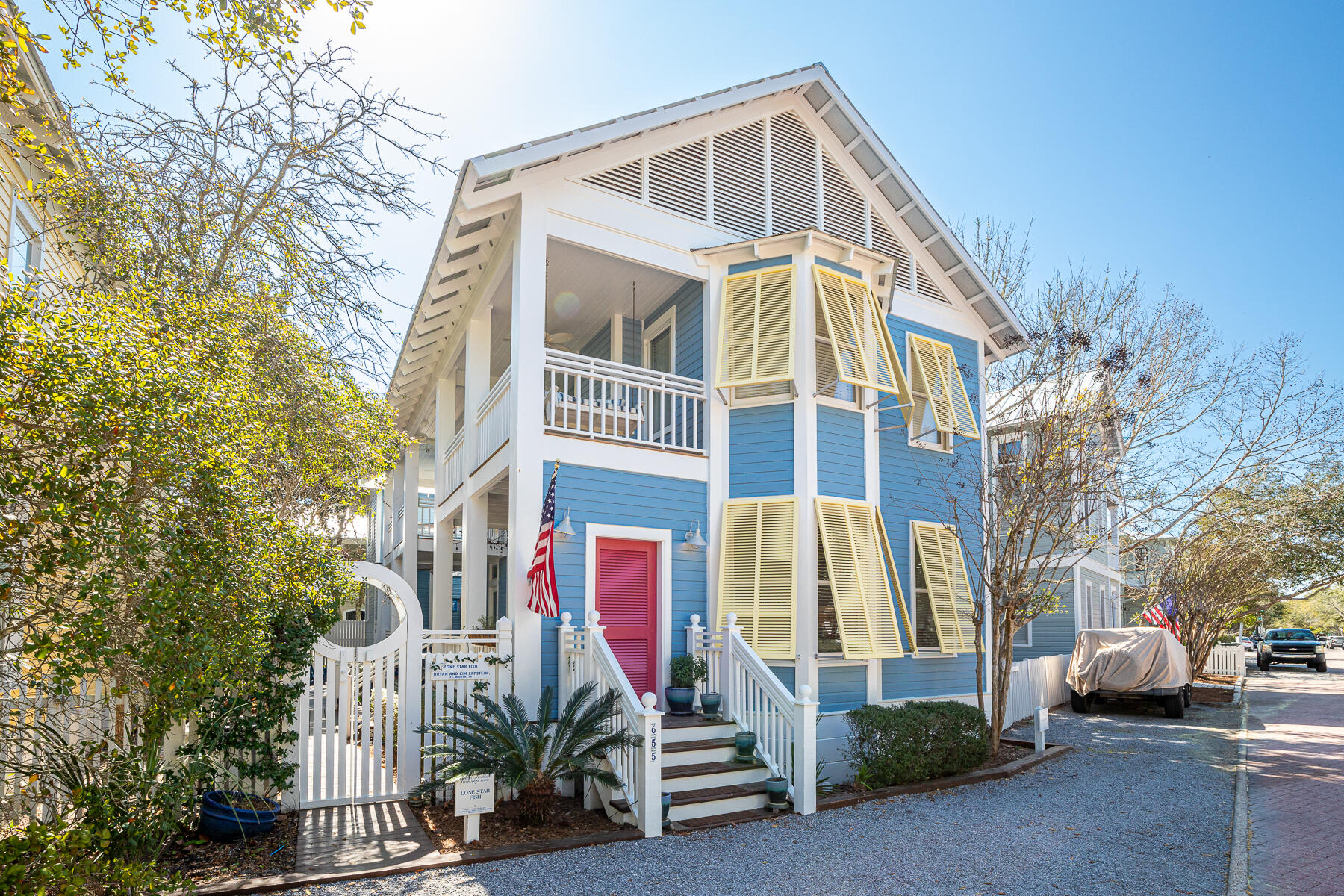 Lone Star Fish commands curbside charm from the moment it catches your eye!  Behind the sunny yellow shutters and that candy apple red front door (which has been featured on Southern Living's social media) is a happy feast for the eyes.  Once entered, you're greeted by a generous porch running the entire length of the house.  Inside, a warm and inviting living room beckons you.  The adjoining dine-in kitchen is spacious, bright and cheerful.  Plenty of cabinets and storage space make for maximum efficiency.  A charming guest bedroom, bathroom and laundry room complete the first floor.

The second floor features a spacious and beautiful Master Suite with its own bathroom, sitting area and private porch. A hallway (with access to a second porch) runs from the Master Suite to a lovely second guest bedroom and bunk room (connected to a Jack-and-Jill bathroom). Moving up, the third level's enclosed tower has two observation decks offering stunning panoramic views of Seaside from sunup to sunset; and bountiful star glazing at night. Numerous built-in bookshelves here, and in other parts of the home, will display your favorite beach reads or those treasured first editions.

Frog Pad (Guest House) is the perfect leap from the Main House to one of the most darling guest cottages in Seaside! Full kitchen, dining nook, living room, and half bath are located on the first floor. Upstairs is a beautiful Master Suite with a lovely and spacious sitting area (providing the perfect place for a cat nap or to curl up with a good book).  Completing the Master Suite is a bathroom, plenty of closet space and a laundry amenity to make your guests most comfortable.  Frog Pad can make a great rental cottage on its own; or combined with the Main House, it completes this beautiful Seaside family compound.

Outside there are several lovely, shaded seating areas for winding down at the end of the day; and plenty of outside storage for all your beach gear.