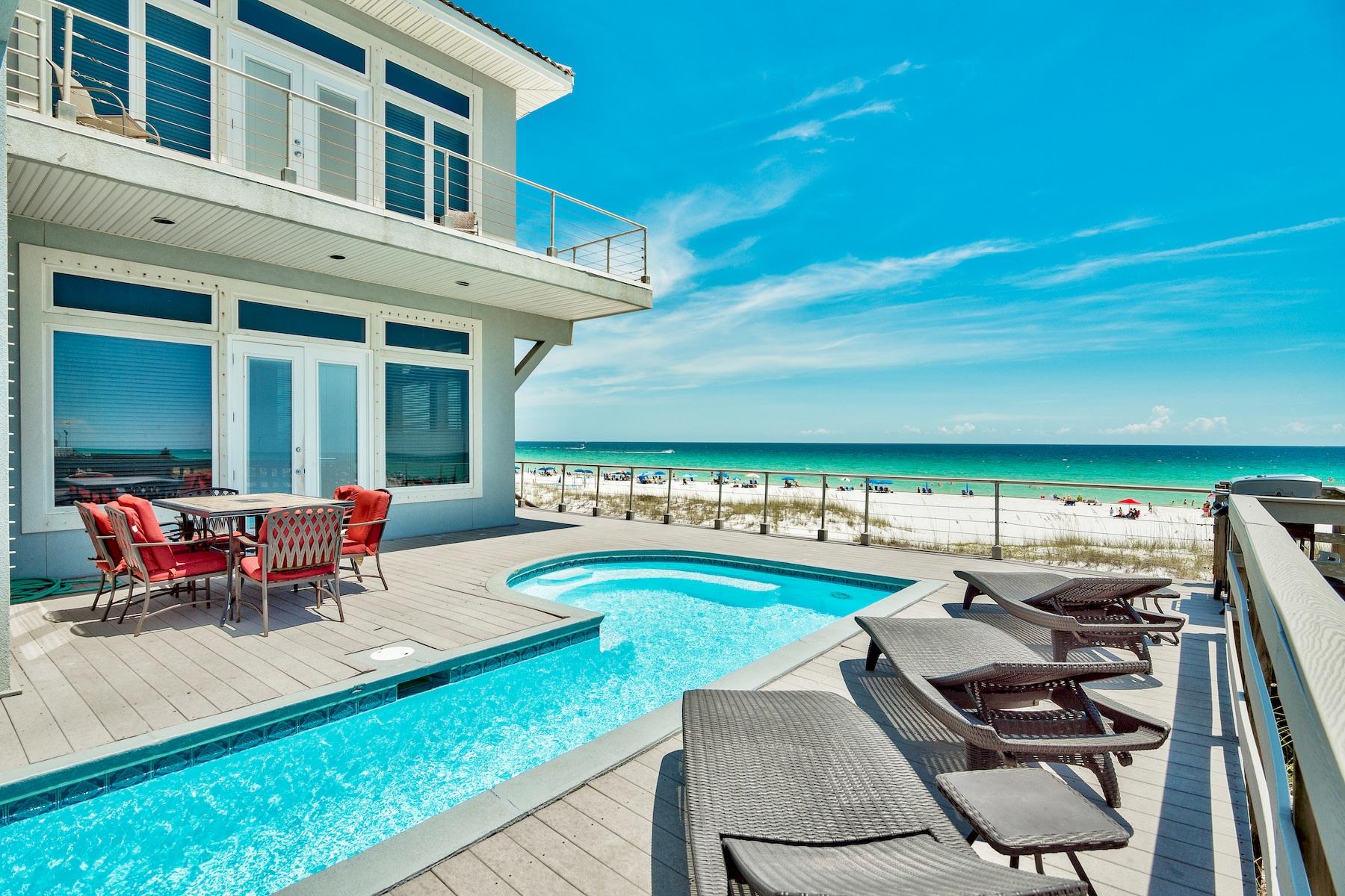 Pristine gulf views framed by floor to ceiling glass define this majestic beach front compound prominently located in the heart of Crystal Beach. This impressive rental machine boasts +$300,000 in projected gross annual income for 2019 with recently updated finishes thoughtfully implemented for optimal rental opportunity and ultimate longevity. Notable features include a sizable main house with adjacent carriage house situated on a prime estate sized lot comprised of 67 linear feet on the gulf of Mexico and over 330' in depth. Gulf views abound from both the main house and carriage house taking full advantage of the expansive acreage on the Gulf while comprised of six full bedrooms in the main house and one additional guest suite in the carriage house. The first level of the main house is a brilliant open concept living, dining and spacious chef's kitchen. Outstanding gulf front views abound with wide open southern and western exposures as this home has been built further seaward than the neighboring property. Immediately off the living area is an oversized gulf front deck, complete with a sizable gulf front pool and ample space for entertaining and lounging in the abundant Florida sunshine. The first level also offers a gulf front bedroom suite and adjoining full bathroom, both of which have access to the spacious rear deck. The second level is the epitome of beach front living highlighted by a gulf front master suite cantilevered over the downstairs living room and lined with floor to ceiling glass windows from the western and southern elevation capturing truly outstanding sunsets unimpeded over the Gulf of Mexico. There are 2 additional bedrooms which also offer excellent beach views and adjoining porches as well. There are two large bunk room that have ample sleeping capacity with optimal function. The adjacent carriage house has been fully remodeled and offers an entire one bedroom apartment complete with a guest suite and adjoining bathroom as well as a full sized living, dining and kitchen area enjoying uninterrupted gulf views down the west portion of the site. The carriage house also features a first level custom game room, with pool table and foosball as well as two sets of comfortable sofas. Crystal Palace is ideally located in Crystal beach with exceptional proximity to world class dining, shopping and golfing as well as Whole Foods and Legendary Marina.
