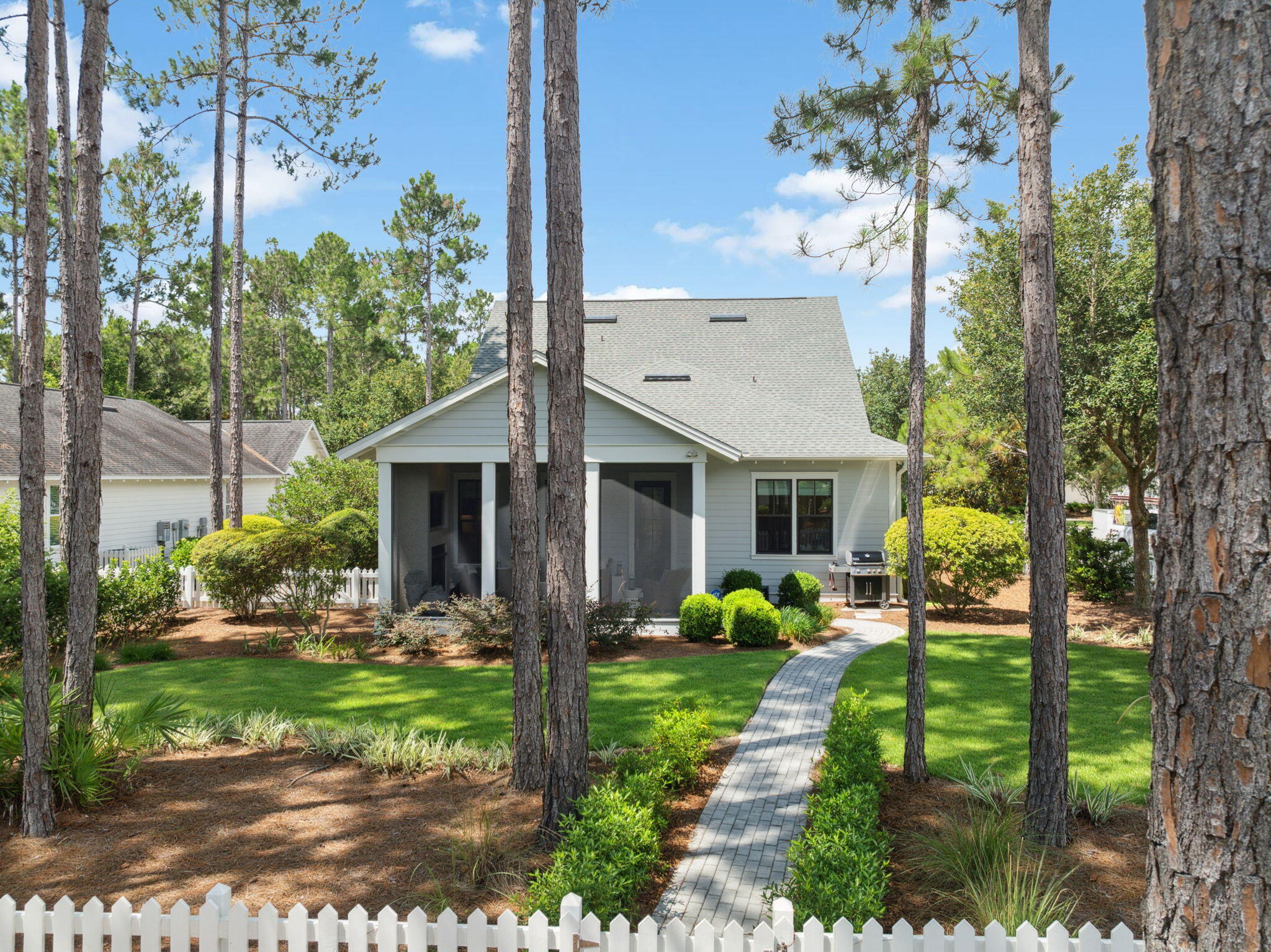 Situated on a prime oversized corner lot in the desirable Winter Garden phase at the front of Watersound Origins, 360 Jack Knife Drive offers a harmonious blend of coastal charm and thoughtful upgrades. This Huff Homes Coral Bean floor plan features four bedrooms—two on the first floor and two upstairs—ideal for maintaining privacy for family and guests alike.
Built in 2015, the home has been significantly enhanced, including a renovated primary bathroom; swapped out the alcove tub (plumbing still available) for a window seat with added storage; Santorini blue marble tile adds a luxe accent throughout the space; fold down teak wall bench in the shower for space-saving convenience; new vanity wall cabinet provides perfect access to all grooming needs with his/her separation. Palecek designer lighting & California closet system complete the luxurious renovation. The bright beachy vibe is amplified by shiplap walls, distressed hardwood floors, and abundant natural light.The gourmet kitchen is equipped with quartz countertops and top-of-the-line Thermador appliances (installed2023) along with pull-out drawers in lower cabinets, a pantry, and a stylish dry bar with beverage fridge. The open-concept design flows seamlessly from kitchen to dining to living areas with custom lighting & Visual Comfort ceiling fans throughout.
Outdoors, the lushly landscaped backyard offers serenity and potentialwith ample space for a pool. Enjoy cozy evenings on the screened porch featuring a fireplace and TV.
Additional highlights:
* Located on a low-traffic street with adjacent park
* Garage system by Garage Experts with epoxy flooring, overhead storage, cabinetry, and slat walls
* Whole-house upgrades including water filtration, surge protection, Flow Tech system, and Kohler continuous clean toilets
* Wired for surround sound in the living room and TVs in all bedrooms
This home is a rare combination of privacy, upgrades, and locationperfect for full-time residents or second-home buyers seeking refined comfort in Watersound Origins.