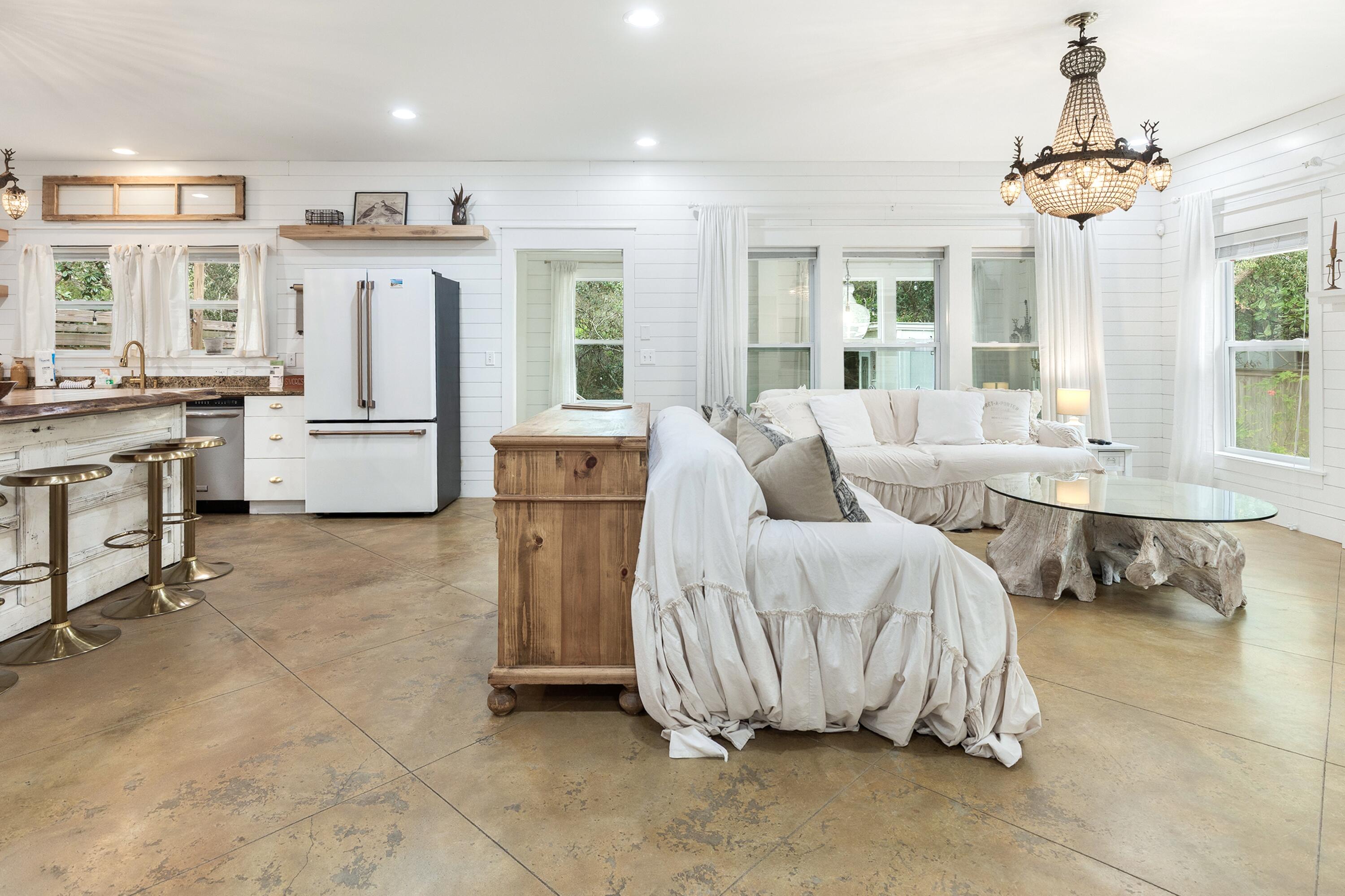 Discover your slice of paradise at 247 N Bishop Rd, a beautifully updated Florida cottage nestled in the sought-after Beach Highlands community of Santa Rosa Beach, right off iconic Scenic Highway 30A. This cozy, high-and-dry gem offers the perfect blend of relaxed coastal living, easy beach access, and strong potential as a full-time residence, second home, or high-demand 30A vacation rental.
Just a short walk or bike ride to pristine Gulf beaches (via the nearby Beach Highlands public access), this home puts you in the heart of South Walton's emerald waters, sugar-white sands, and world-famous 30A lifestyle—minutes from boutique shopping, acclaimed restaurants, state parks, and coastal dune lakes. Step inside to timeless charm and modern comforts: fully furnished with rustic yet elegant decor, stunning chandeliers, granite countertops, a standout live-edge cypress island, stainless steel appliances, gas cooktop, custom range hood, antique doors, and shiplap accents throughout. The warm, inviting vibes create that true "welcome home" feel ideal for family gatherings or quiet evenings.
Outside, entertain on the expansive deck overlooking a large, private backyard that backs to peaceful wooded lot for ultimate tranquility. Plenty of space for pets to play, outdoor dining, or simply soaking up the Florida sunshine. No rear neighbors means rare privacy in this prime location!
Additional perks include proximity to the prestigious Santa Rosa Golf & Beach Club (just minutes away for championship golf, beach club amenities, and waterfront dining). Whether you're seeking year-round beach living, a weekend escape, or an income-generating 30A rental property in one of Florida's hottest markets, this turnkey cottage delivers.
Don't miss this rare opportunity in Santa Rosa Beach schedule your showing today and start living the 30A dream!
(Approx. 1,685 sq ft, 3 beds, 2 baths, built 2010 - fully furnished and move-in ready.)