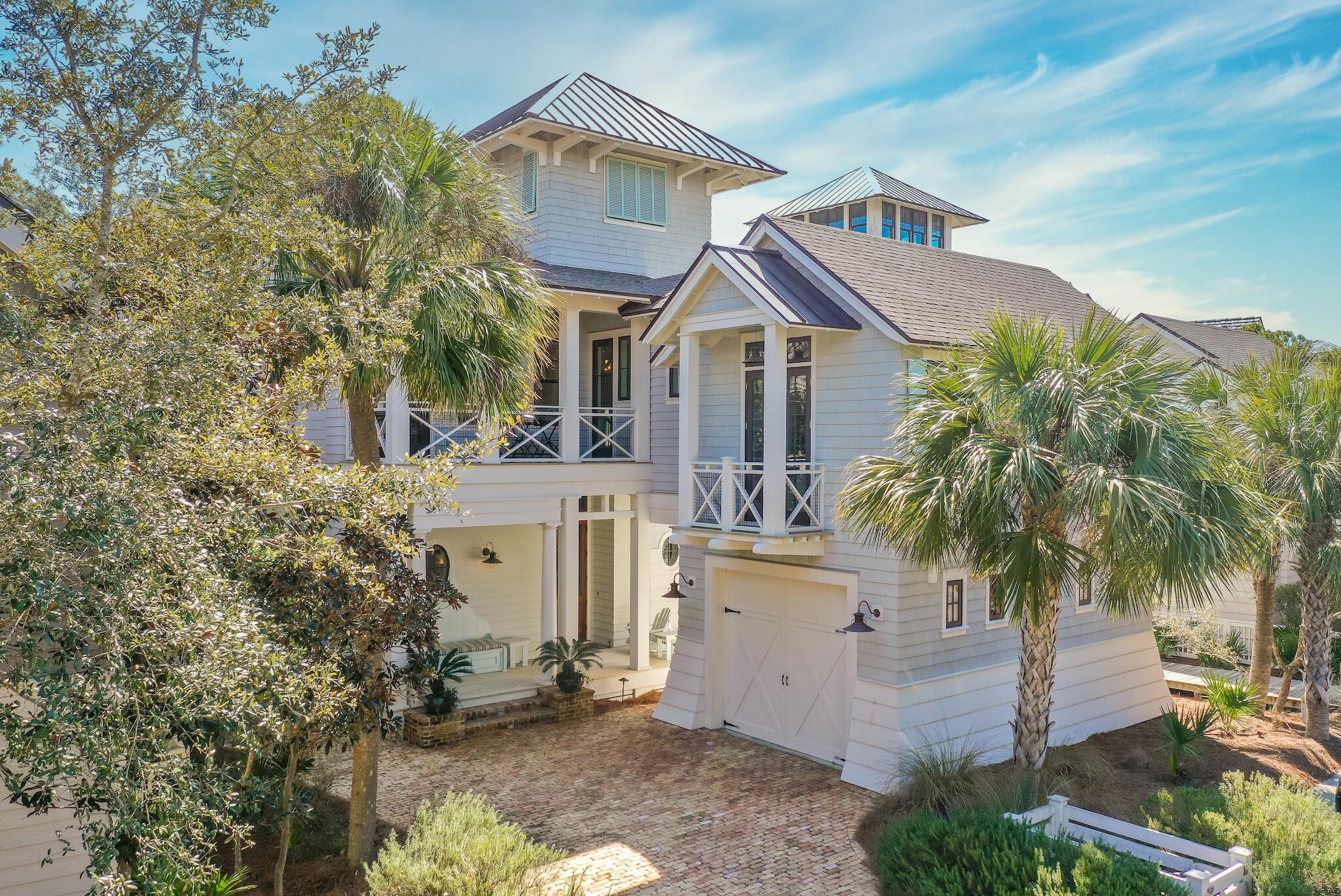 This stunning residence located in the Passages District takes full advantage of the surrounding topography and pristine Gulf views while showcasing the Nantucket inspired architecture found throughout Watersound Beach. Designed by architect Tom Chris and built by the renowned team at Velvet Sun Home Builders, the open floor plan features nearly 4,000 square feet of thoughtfully designed living space. Upon entering the front door you are greeted with a grand staircase adorned with shiplap accents. The living area boasts custom built-ins showcasing the brick accented fireplace. The chefs kitchen encompasses ample cabinet space, an oversized island with hammered copper farmhouse sink, and a professional grade appliance suite. Synonymous with relaxation, the heated plunge pool bordered with lush vegetation is the perfect place to unwind. With six bedrooms, this residence was created to provide the ultimate retreat for immediate and extended family alike. Watersound Beach resides on 1,400 acres and over a mile of private white sugar sand beaches. The culmination of amenities and exclusiveness affords residents with the epitome of private coastal living while remaining geographically poised near the world-class dining and entertainment venues 30A has to offer. 69 W Yacht Pond Lane is a rare never-rented sanctuary to be cherished by discerning owners for years to come- inquire today to schedule a private viewing.