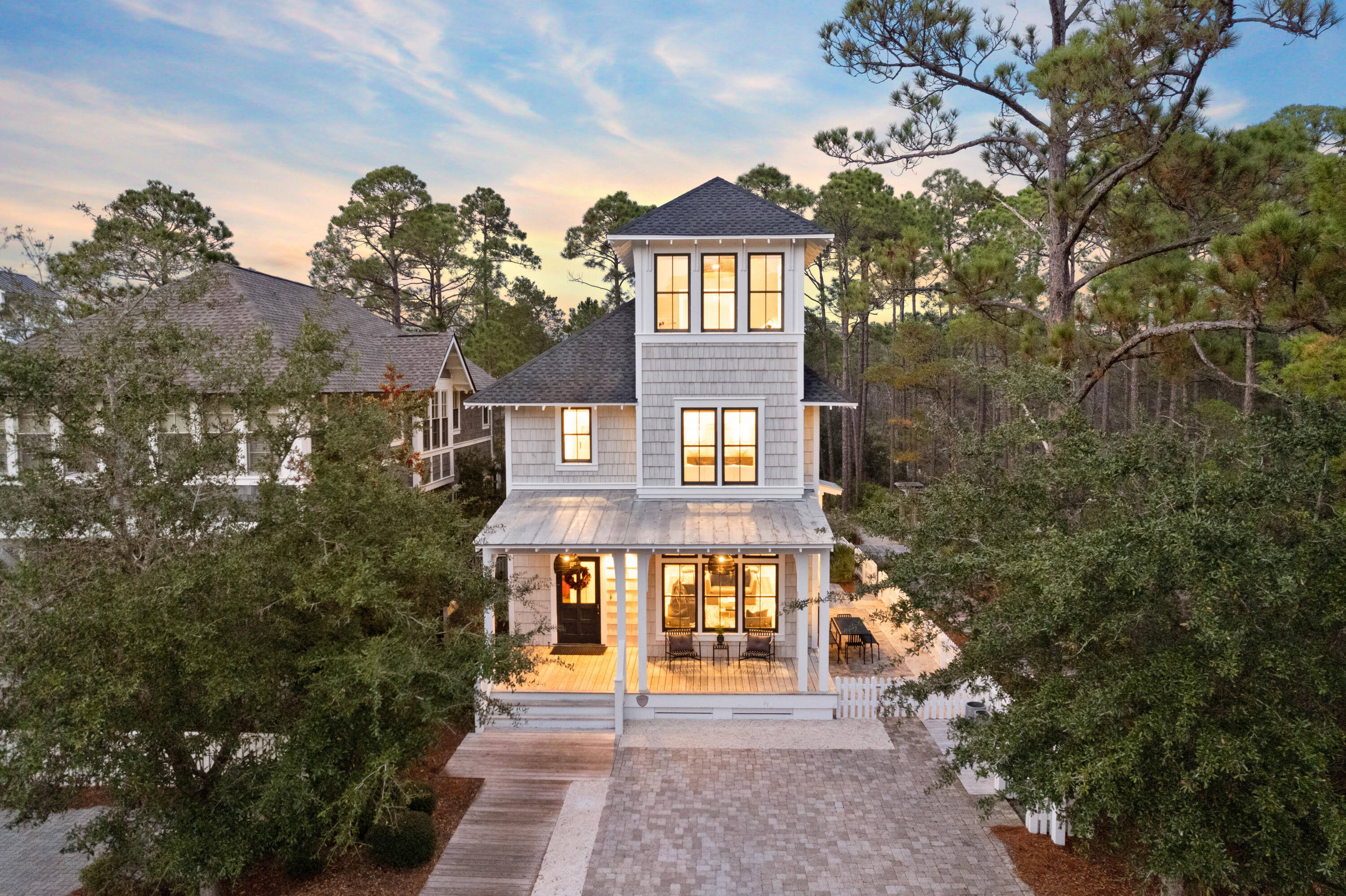 Situated on the most elite homesite in Watersound West Beach, 395 Tumblehome Way is bordered by vast natural state park offering the utmost privacy. Located adjacent to the beach walk-over and community pool, this property offers premier access to the amenities, natural resources, and the sugar white sands of the emerald coast beaches. This renovated  craftsman home features true wide planked hardwood flooring, wood beam-work and luxury appliances as well as hand-selected fixtures, lighting and tile. Recent renovations include a new roof, re-finished flooring, updated tile, new lighting, new paint throughout and so much more! This home has been professionally designed and is offered fully furnished. The well-thought-through floorplan showcases an expansive open concept living space on the main level, a large master suite, 3 guest bedrooms, 3 guest bathrooms, a bunk room and office. Plenty of storage can be found throughout the every level of the home. 

Multiple outdoor entertaining spaces can be found around the homesite including a large front porch, enchanting back porch and extensive side porch overlooking the state forest. Features of the outdoor area include an outdoor shower and outdoor kitchen. 

Watersound West Beach is a gated community located in the highly sought after east end of 30A. Amenities include a large resort pool, walking trails and deeded beach access. Offering great potential for rental income, 395 Tumblehome Way would make the perfect investment property, second home or primary residence.