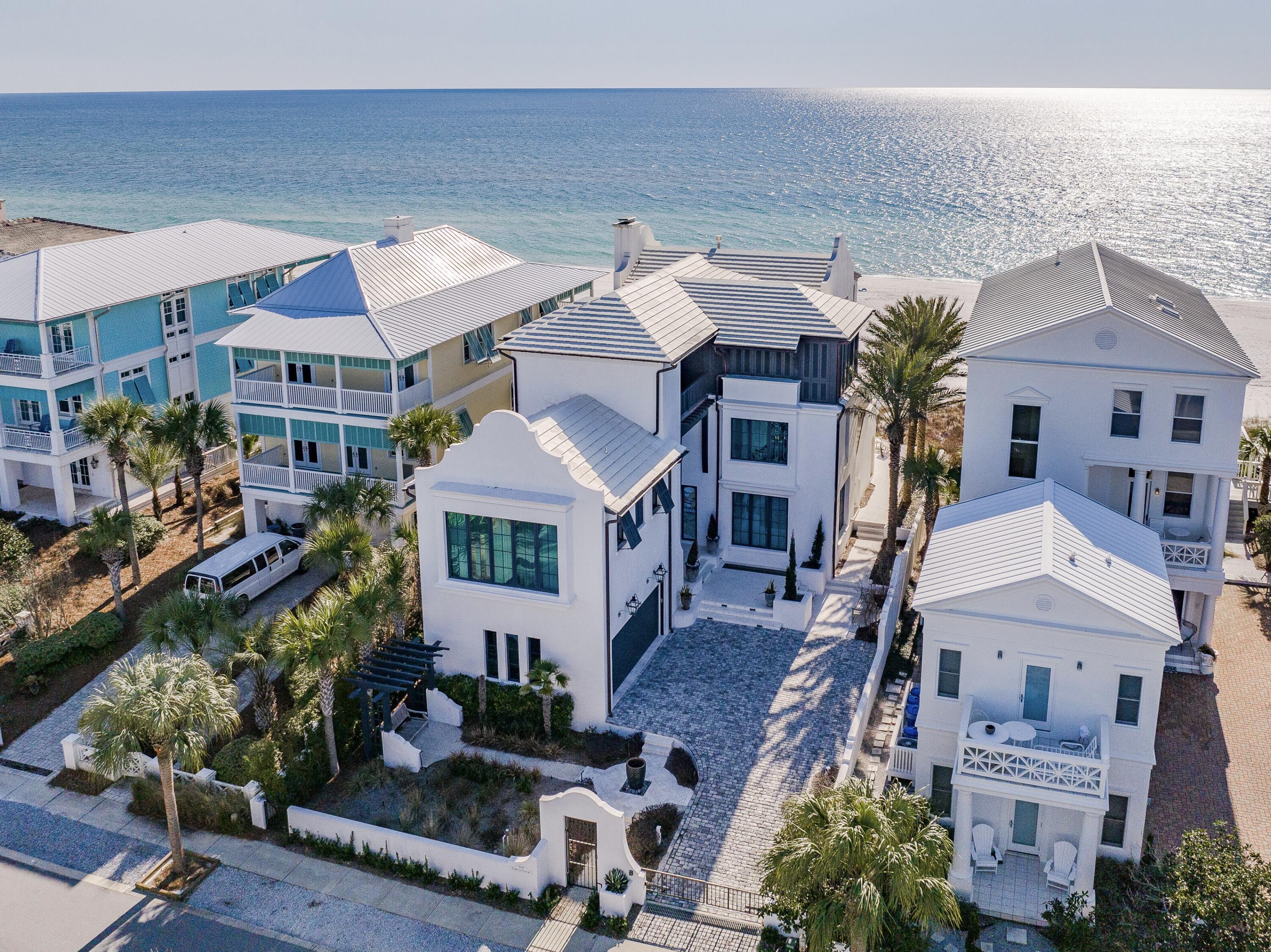 Though the phrase ''one-of-a-kind'' is often cavalierly tossed around,  it definitely applies to this Carillon Beach gulf-front gem.  Featuring rare, wholly unobstructed views of the gulf from the main floor and master BR enhanced by a gulf-front infinity pool and hot tub, this Smart-home masterpiece designed by  A BOHEME boasts all the class, amenities, layout and furnishings you would expect. Stucco over block construction with custom German-made sliding doors spanning the entire expanse of the main living area and master BR and situated in the quiet, gated community of Carillon Beach, this waterfront home exudes elegance from every corner.  If you are seeking a generational home away from the traffic hustle and bustle of 30A, this is it! Carillon boasts 3900 linear ft. of pristine just re-nourished, never-crowded sugary sand beach. Within the spacious 5369 HC sqft. are total of 4 BR and 6 baths with media room easily convertible to a 5th bedroom, if desired (as full bath attached). No detail or expense was spared in design and construction of this beach haven including, elevator, numerous Smart-home features, custom appliances and Venetian plaster in the master bedroom. Carillon Beach is a quaint, private, strategically situated and secluded community. The upscale shopping and restaurants of Rosemary Beach and 30AVENUE are but a 5 minute drive away. Carillon will never experience the heavy traffic associated with certain other high-end areas due to its being gated and buffered on the west by Lake Powell and the state park, allowing you to enjoy proximity to all of the many benefits of 30A with none of the burdens. Further, unlike several communities to the west, Carillon homes abutting the beachfront do enjoy direct access to the beach without having to navigate to a public walkover. And. . . golf carts are permitted in the community.